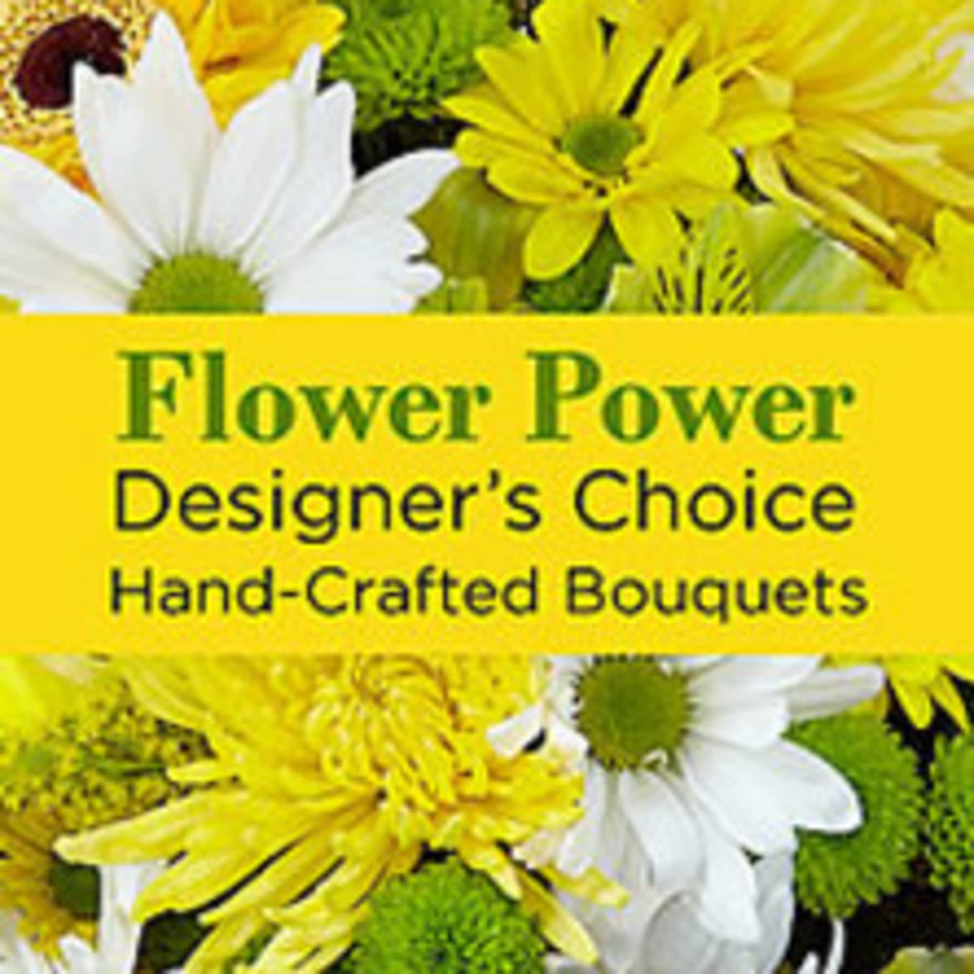 Bright assortment of mixed seasonal flowers in yellow tones arranged in a Bright assortment of mixed seasonal flowers in yellow tones arranged in a