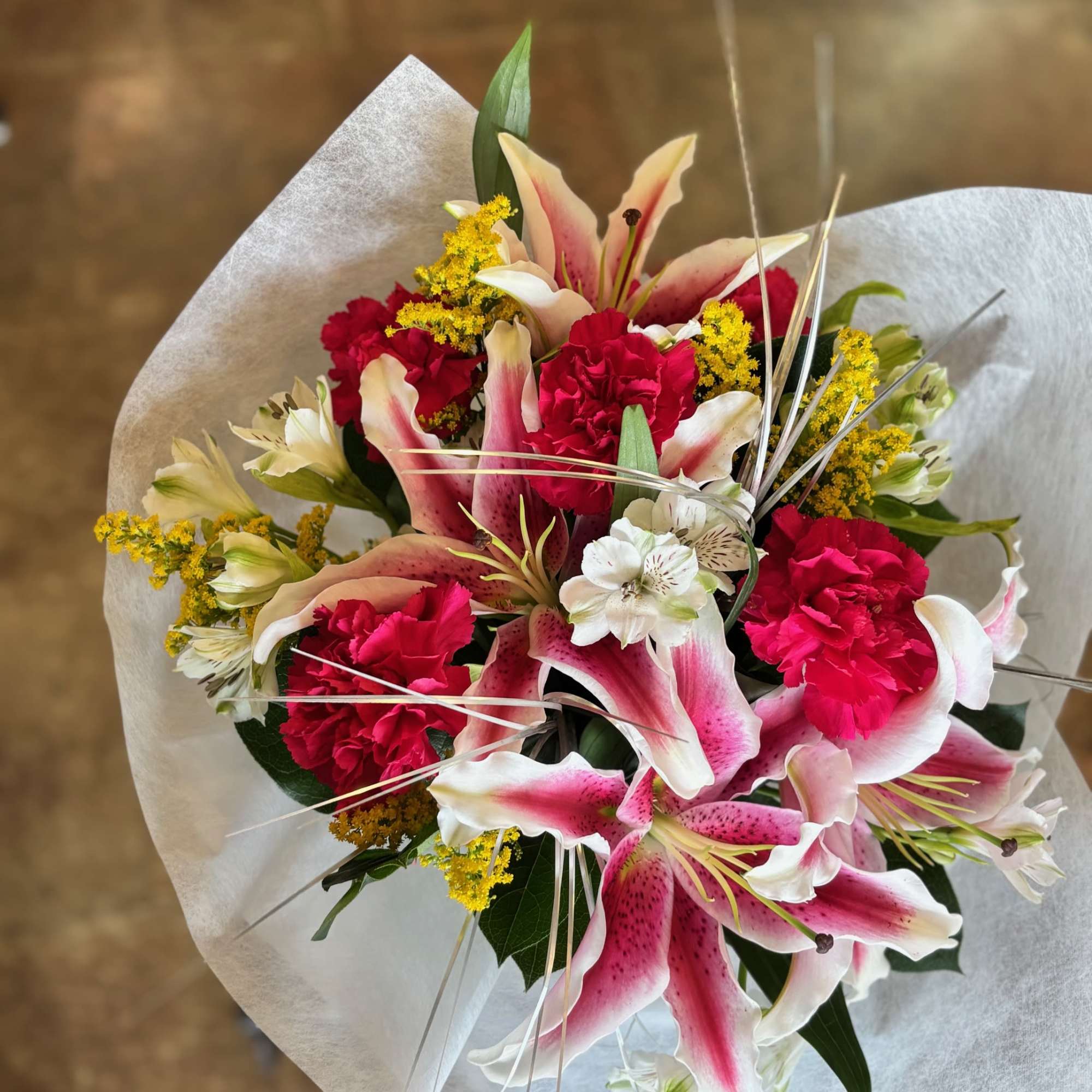 Cheery Stargazer lilies to uplift and brighten someone&#039;s day.

Please note: This arrangement