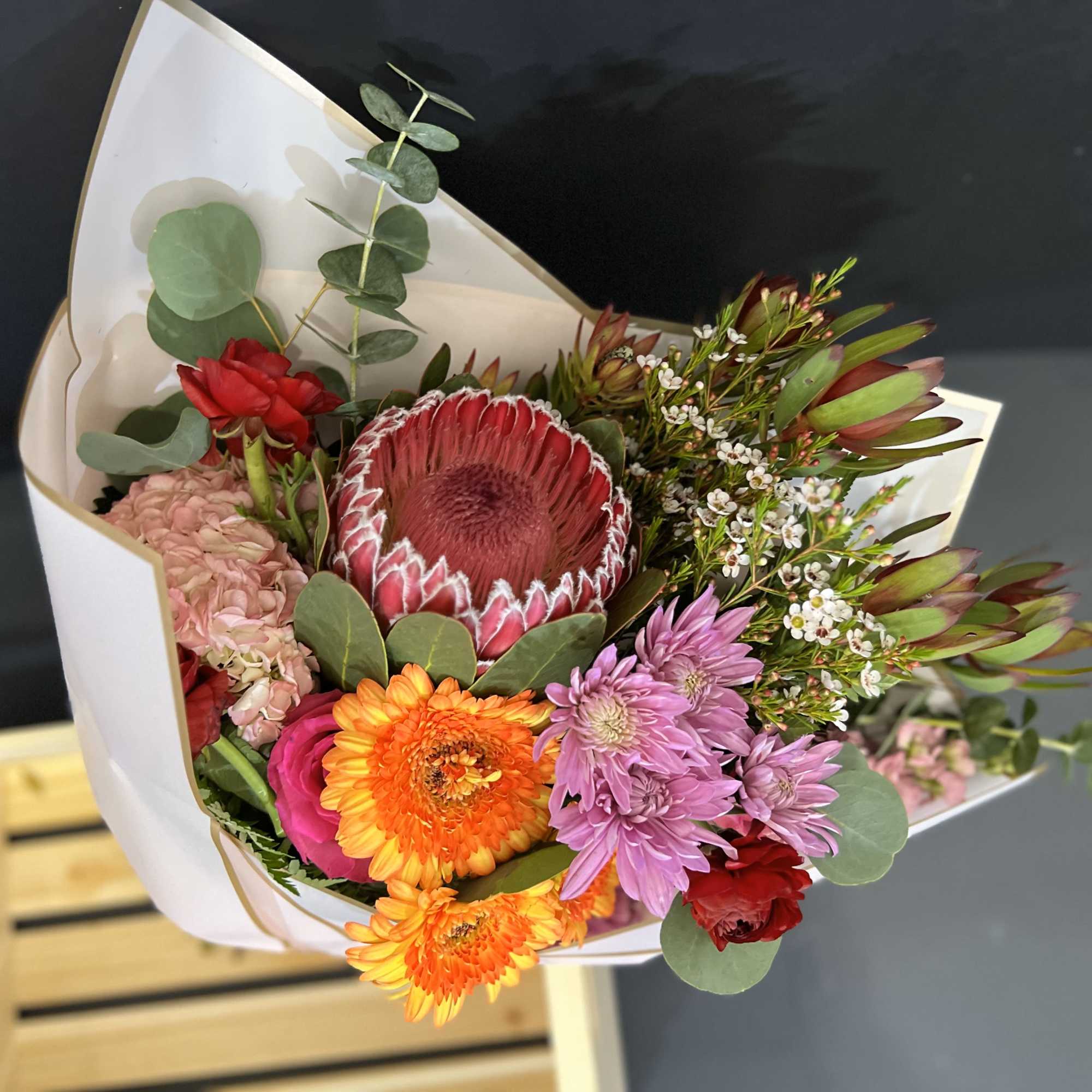 A wrapped bouquet using tropical flowers or customized. 