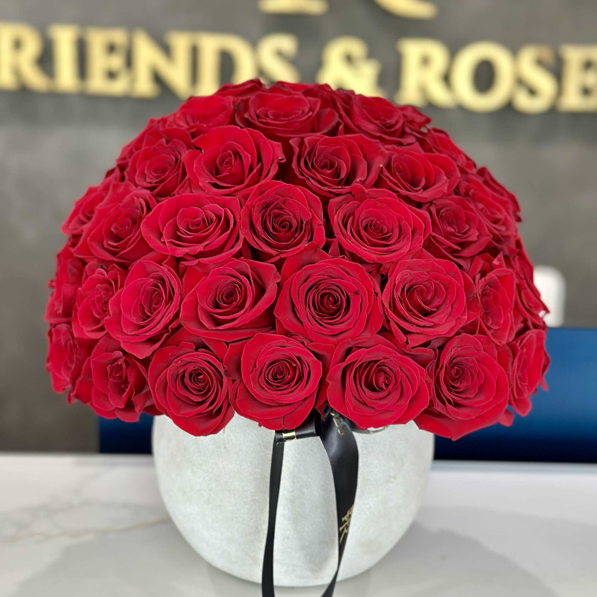 A beautiful round arrangement of roses, their petals gracefully arranged in a