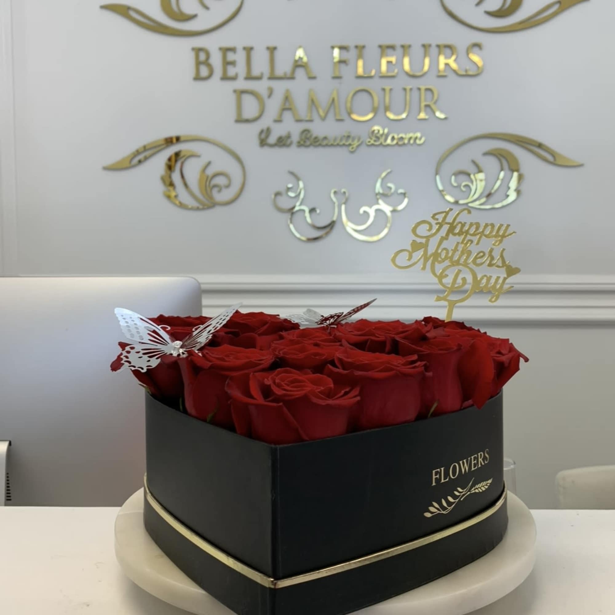Our rose heart box elegantly arranged with red roses and our golden