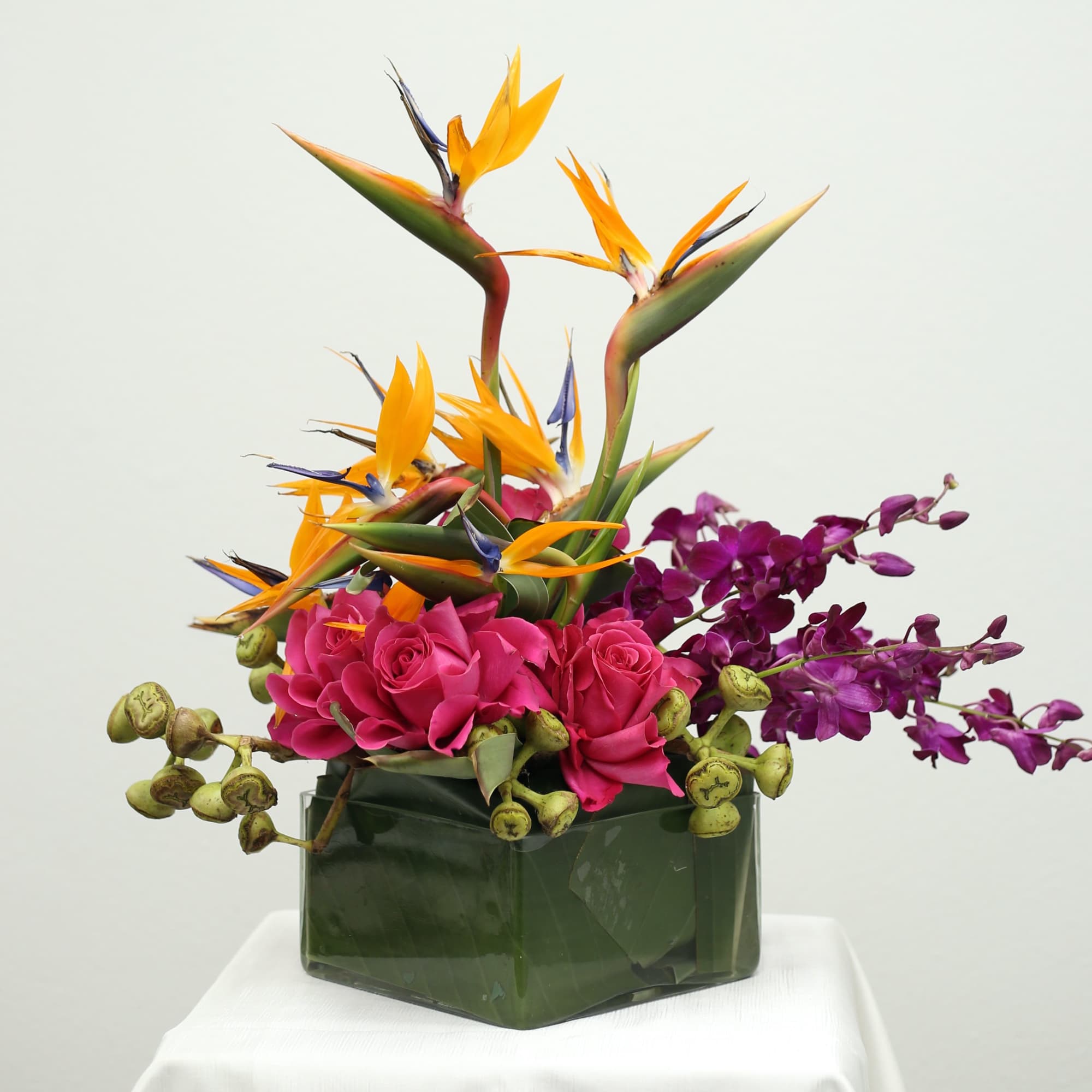 Bursting with color and personality, this exotic arrangement features striking Bird of