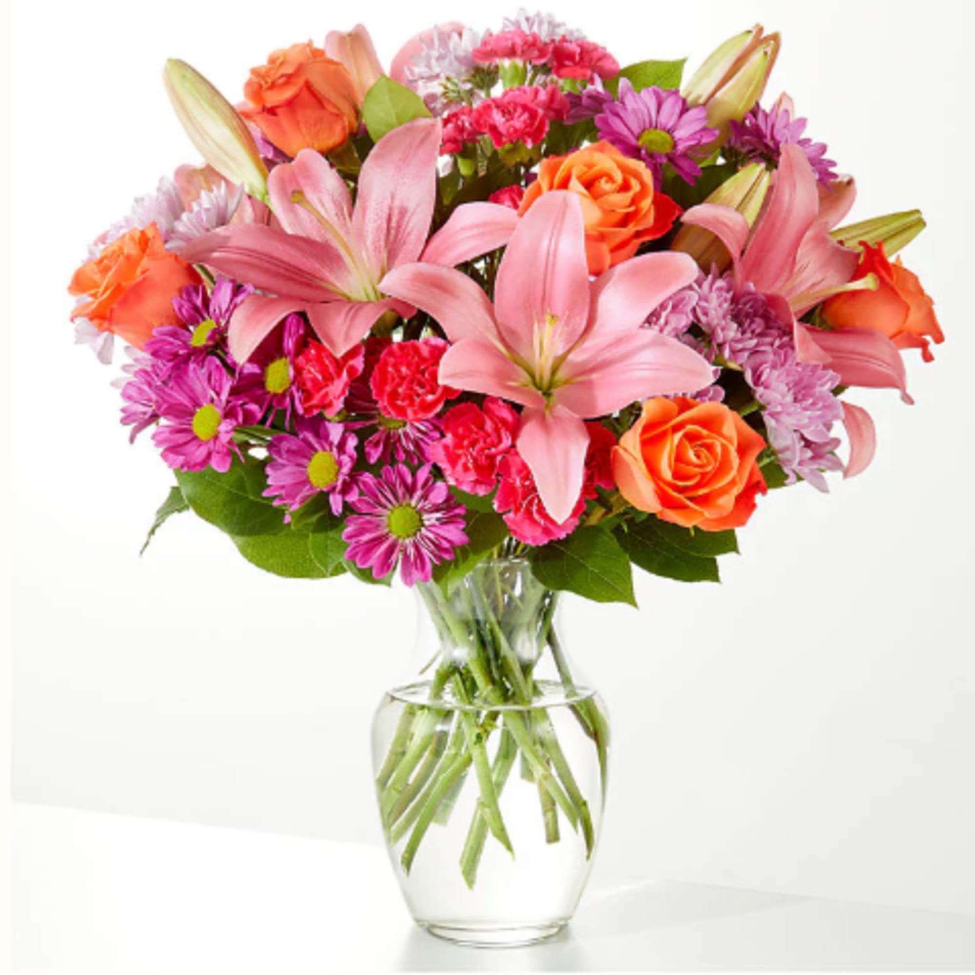 A carefully selected blend of roses, daisies, and lilies make for a