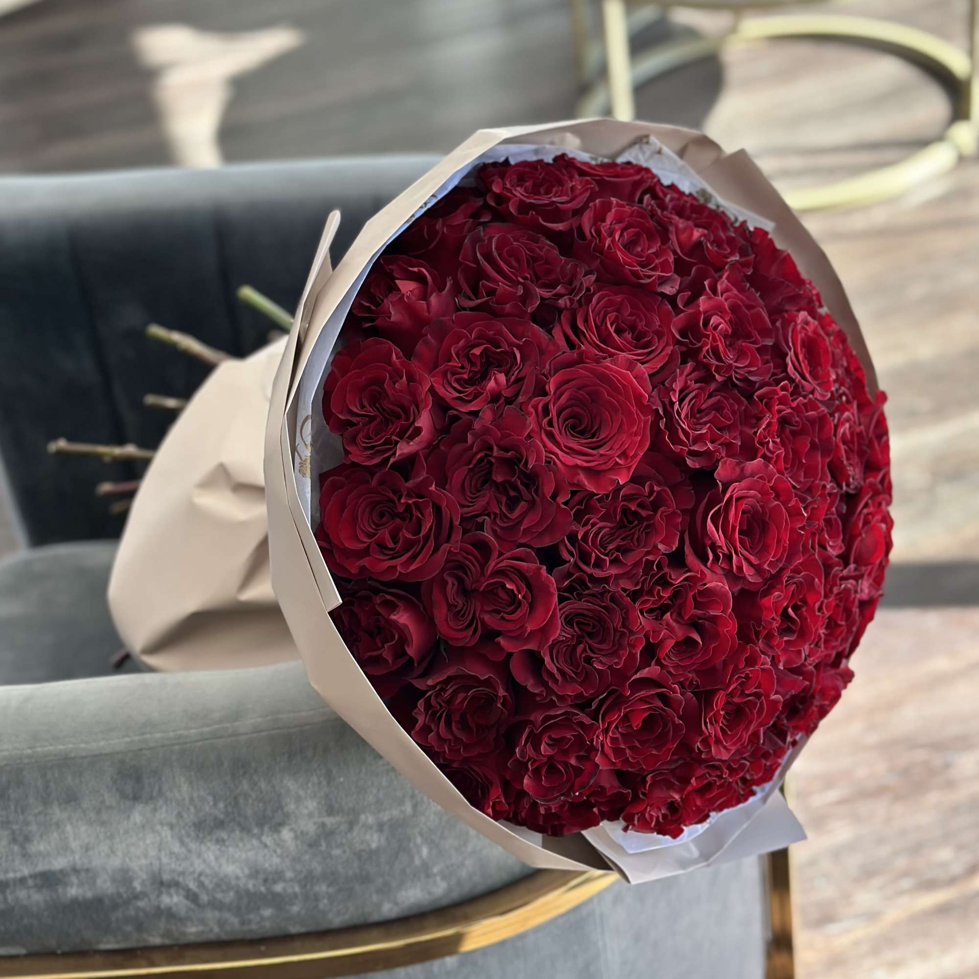 A bouquet of red fluffy roses features rich, velvety blooms with soft