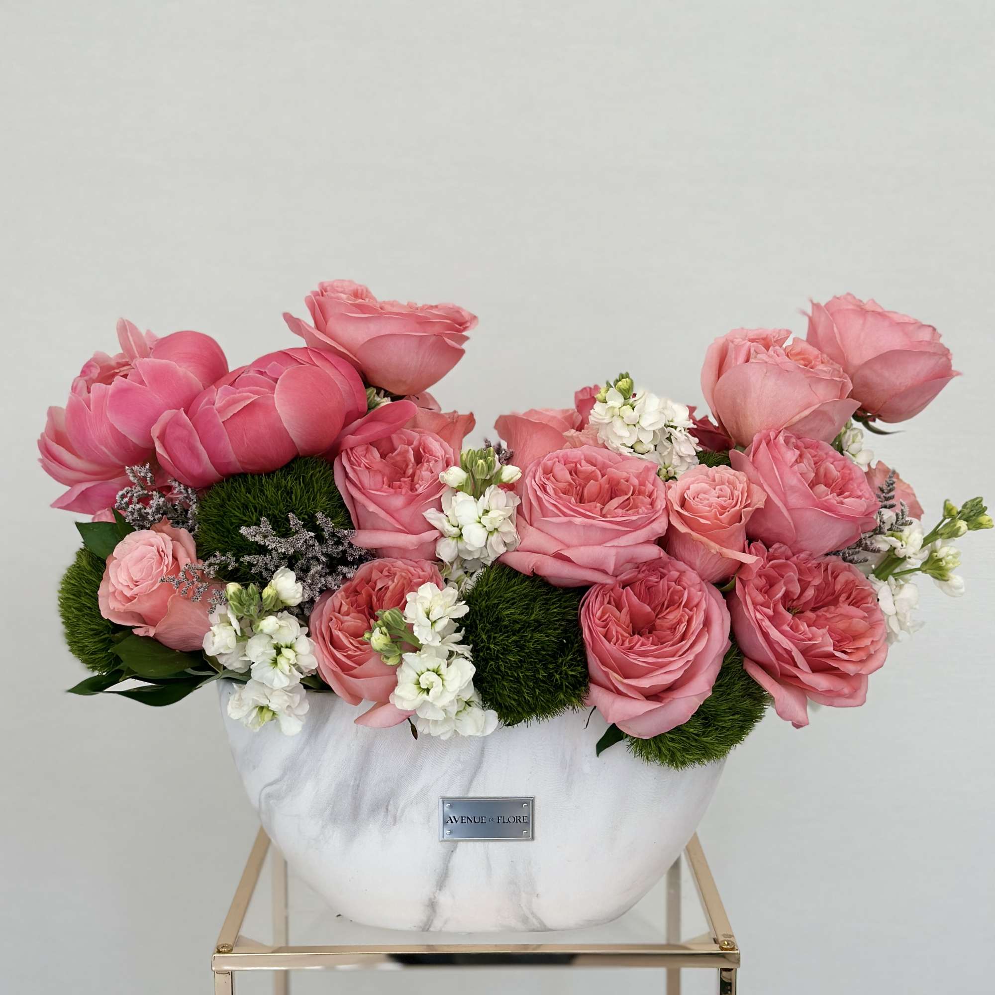 Let the fragrance of garden roses and peonies whisk you away to