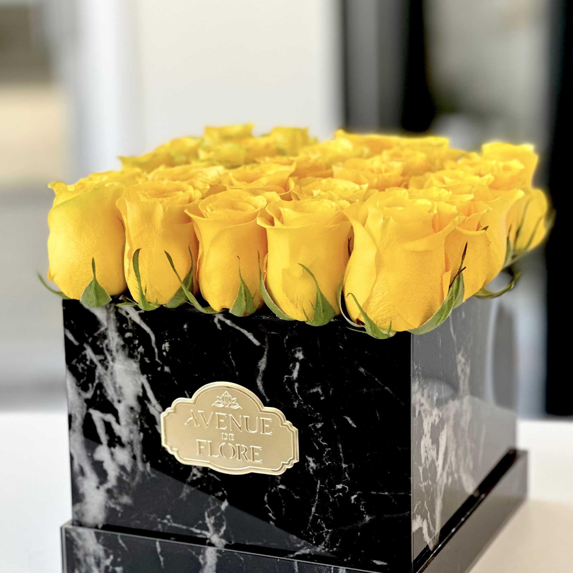 Convey sentiments of friendship, happiness, and positivity with yellow roses nestled in