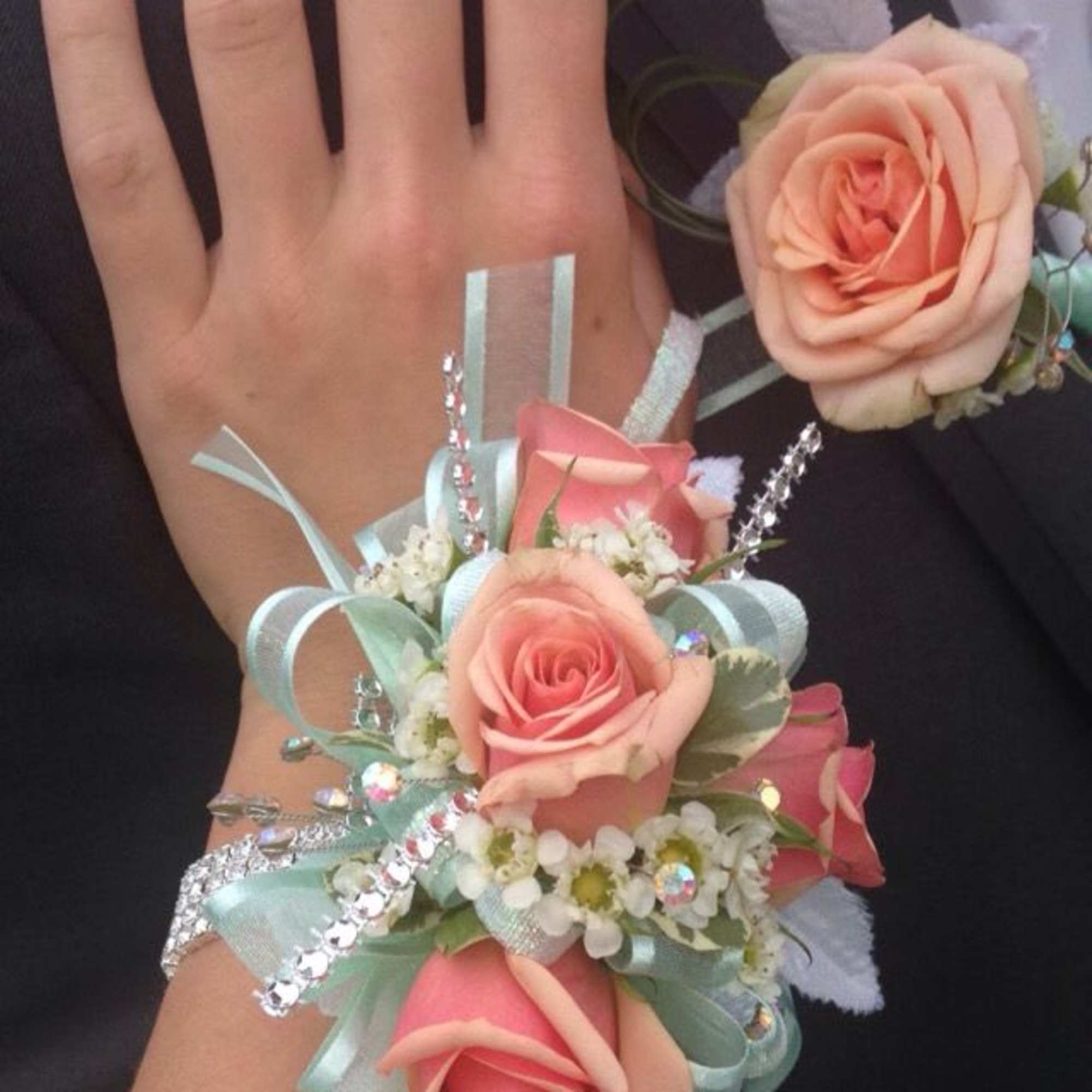 Wrist corsage and boutonniere customized to match perfectly. Please specify details in