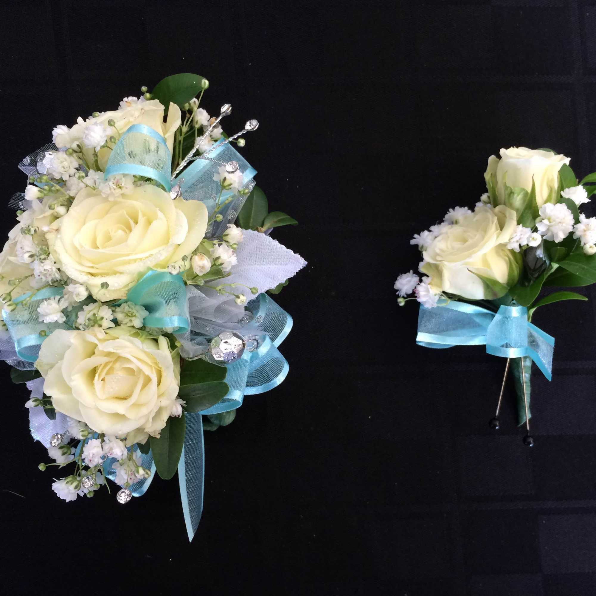 Wrist corsage and boutonniere customized to match perfectly. Please specify details in