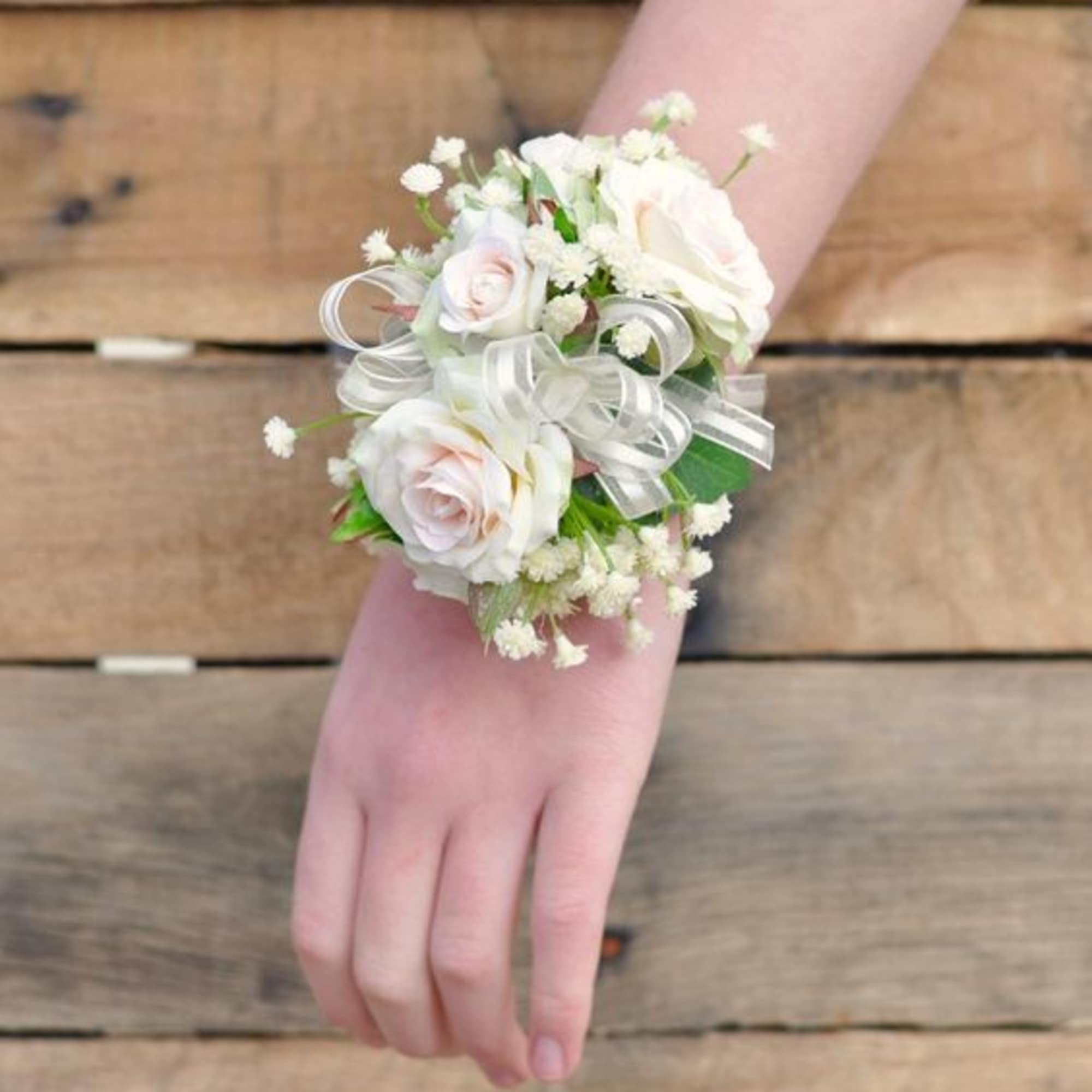 wrist corsage done with small roses with delicate accents*can customize color of