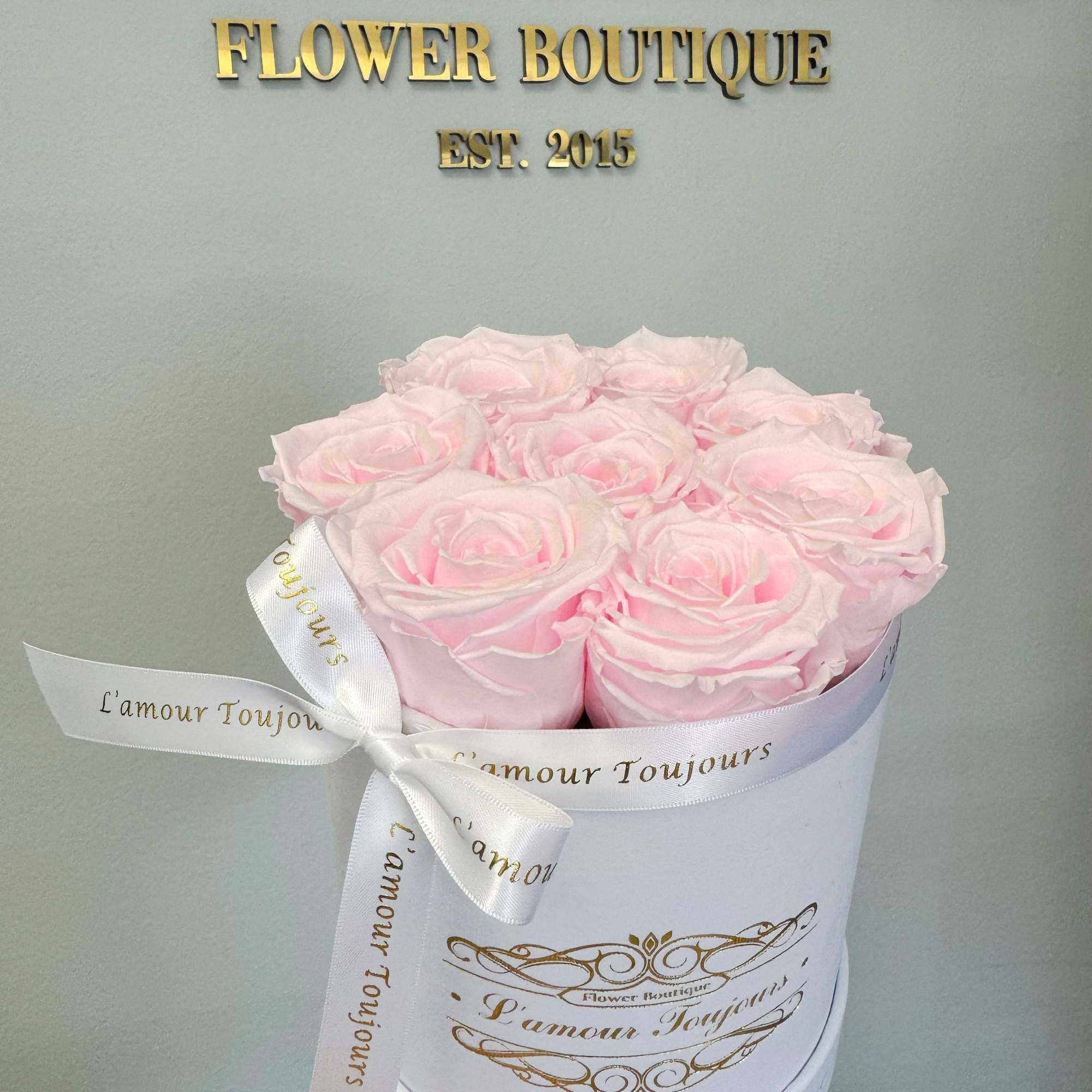 Mini white velvet box with 8 Everlasting roses. Everlasting roses are real