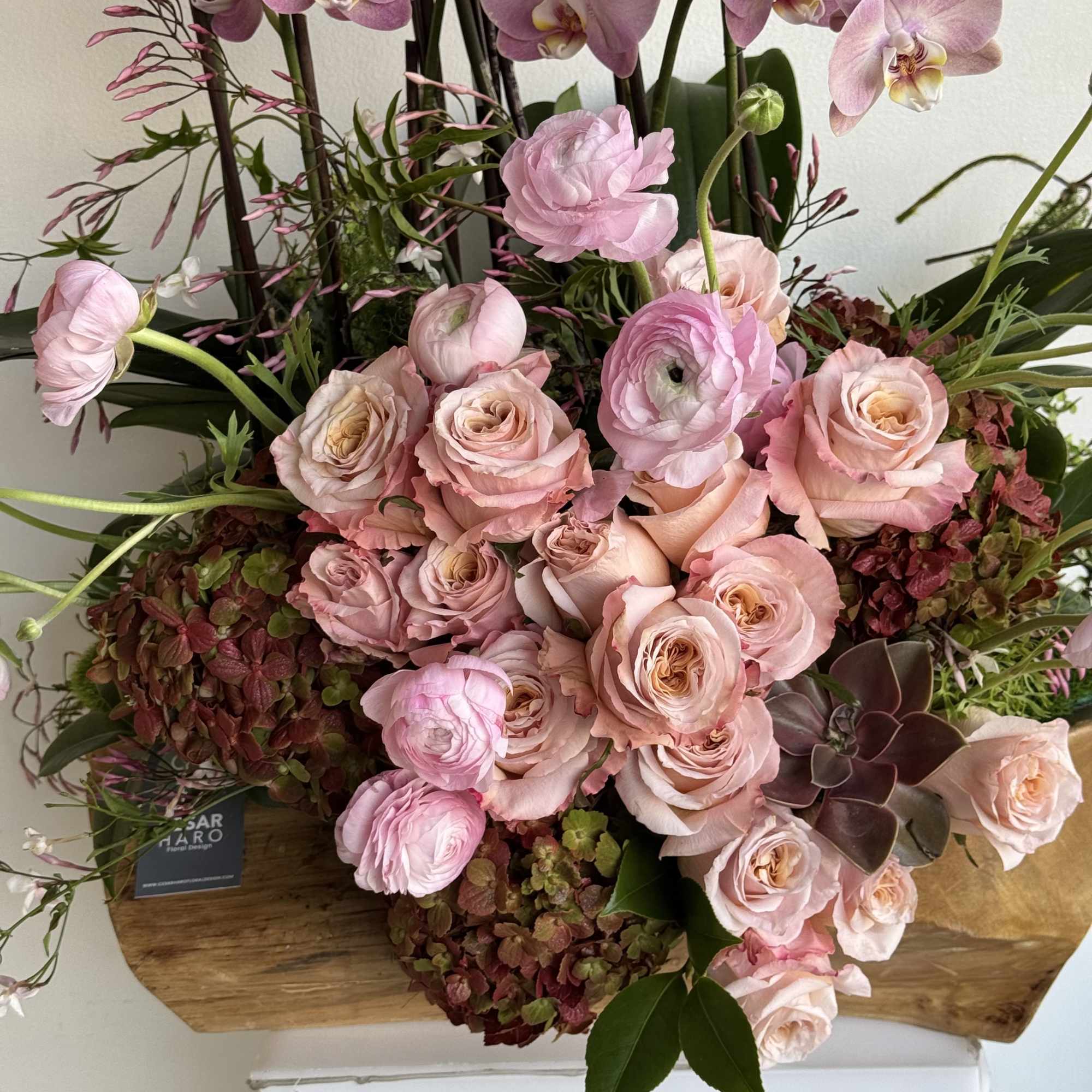 Teakwood container beautifully designed with flower and also orchids