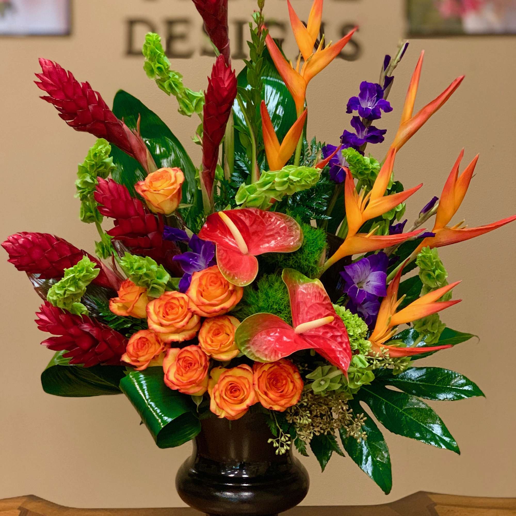 A spectacular tropical bouquet with red ginger, bird of paradise, anthurium, orange
