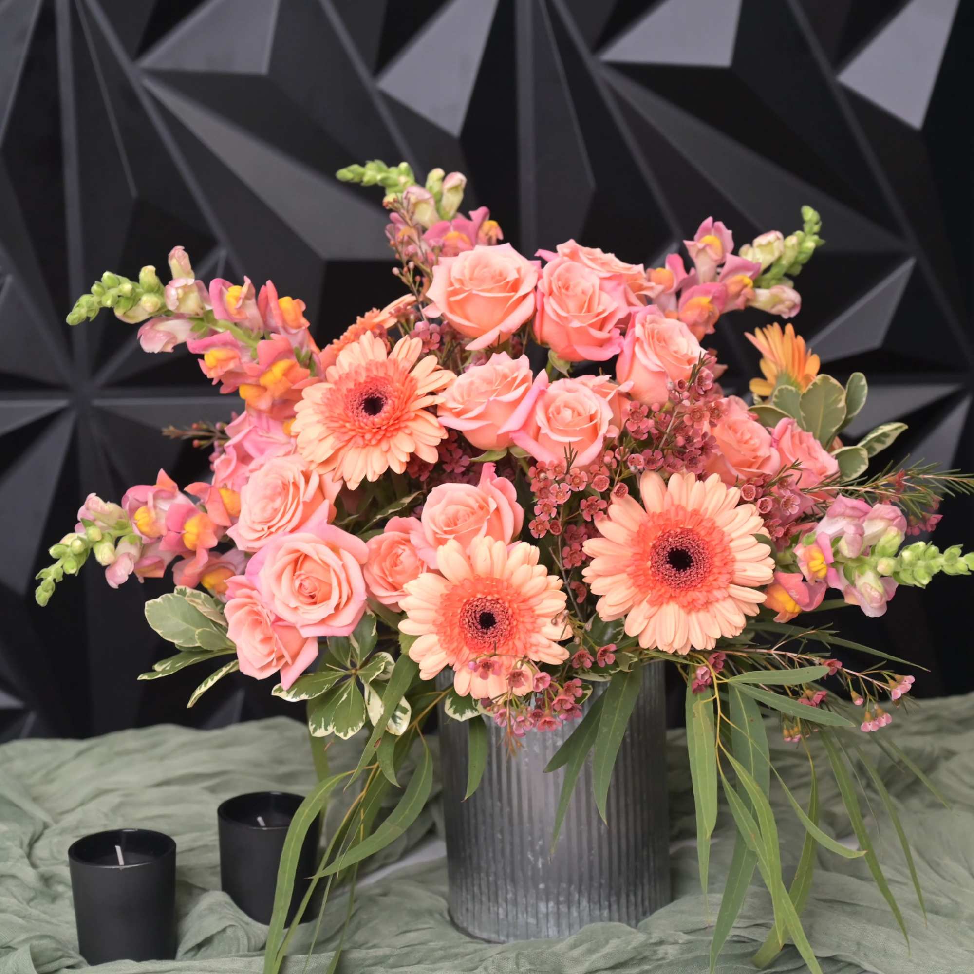 Clasic and modern floral design fusion presented in a tin vase. 
