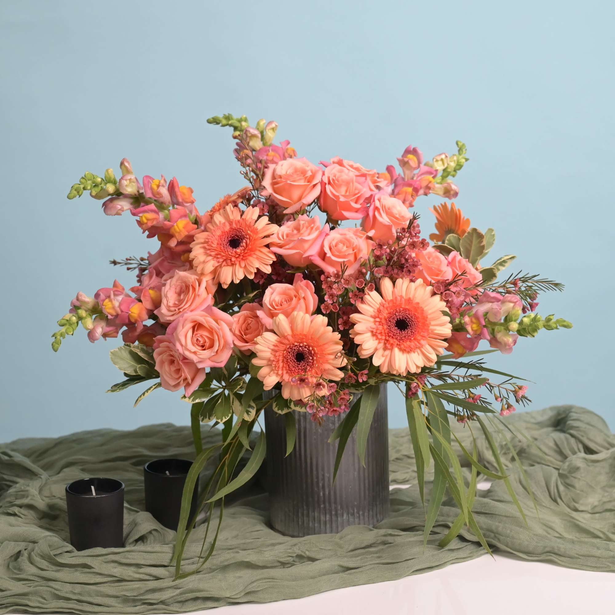Clasic and modern floral design fusion presented in a tin vase. 
