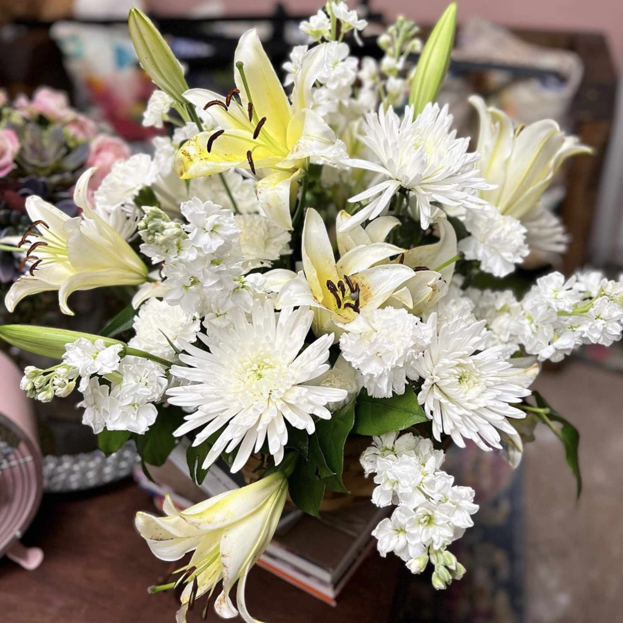 DESIGNERS CHOICE Array of All White Fresh Cut Florals place in a