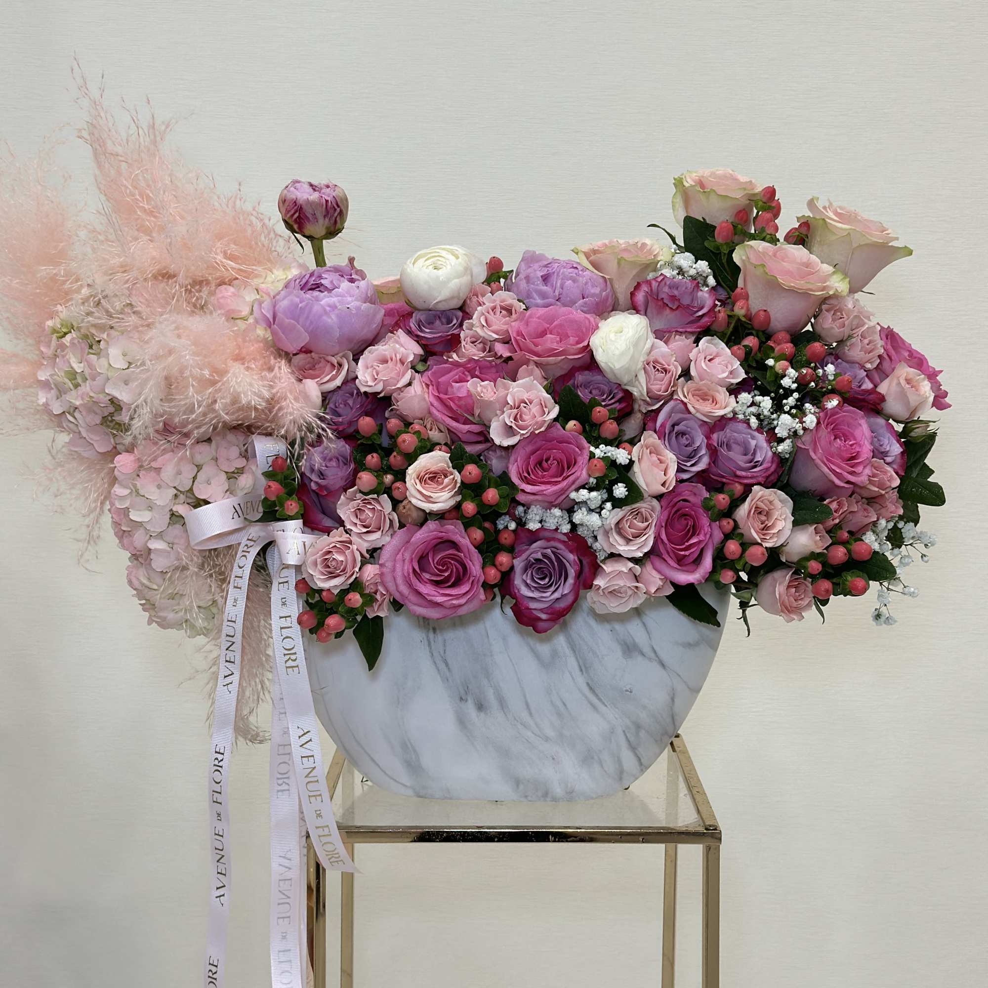 This gorgeous vase arrangement is filled with a mix of pink and