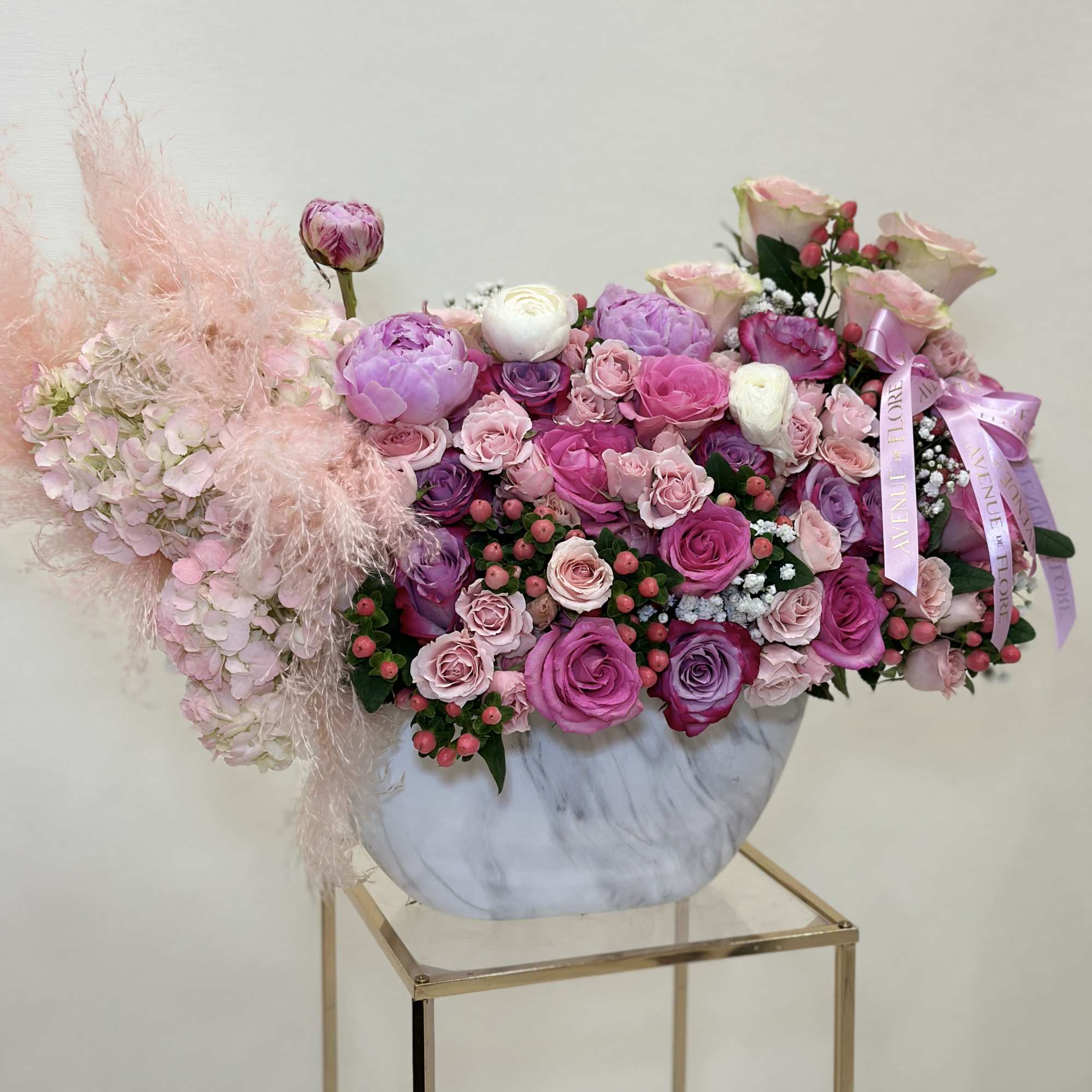 This gorgeous vase arrangement is filled with a mix of pink and
