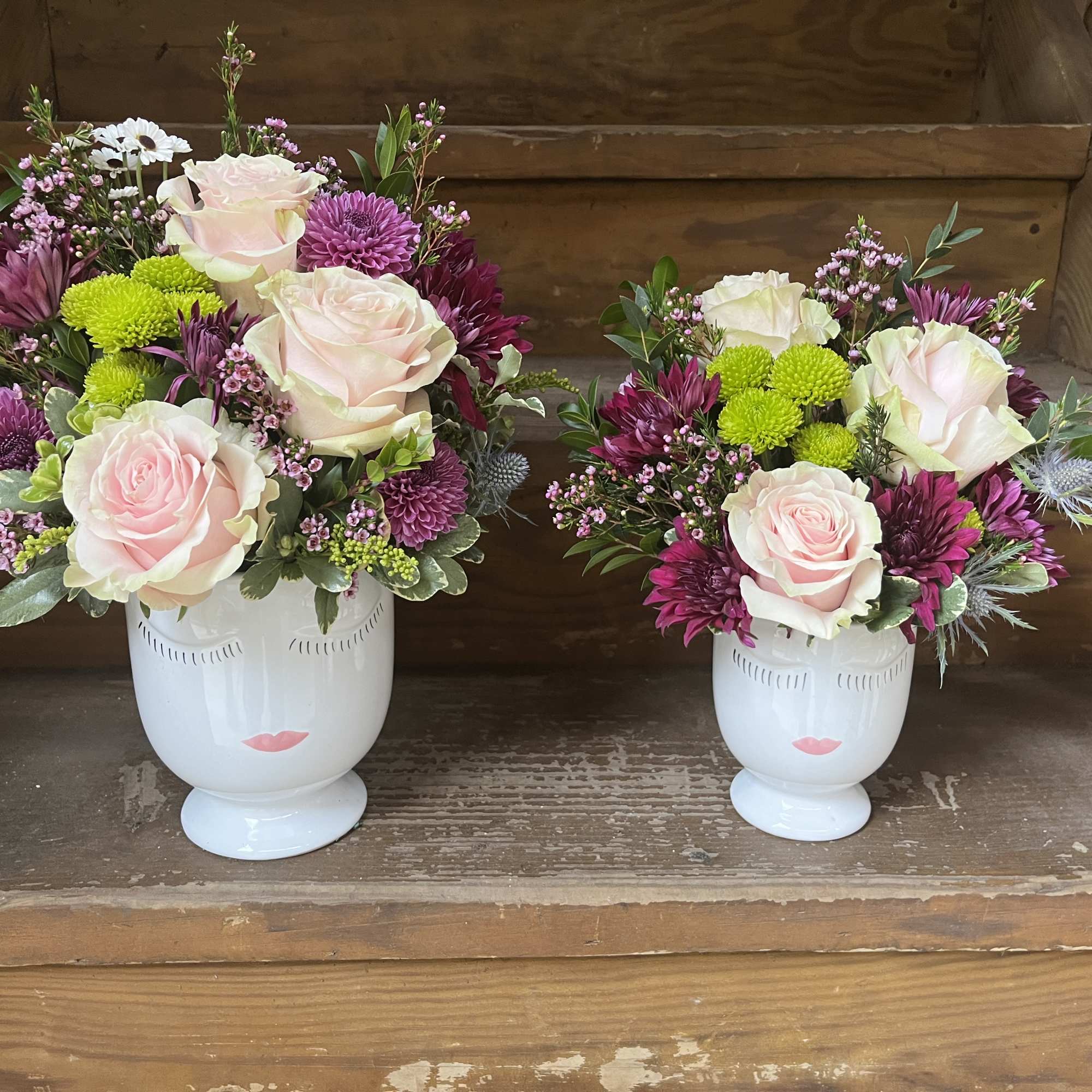 Face vase with floral accents available 2 sizes - flowers will vary