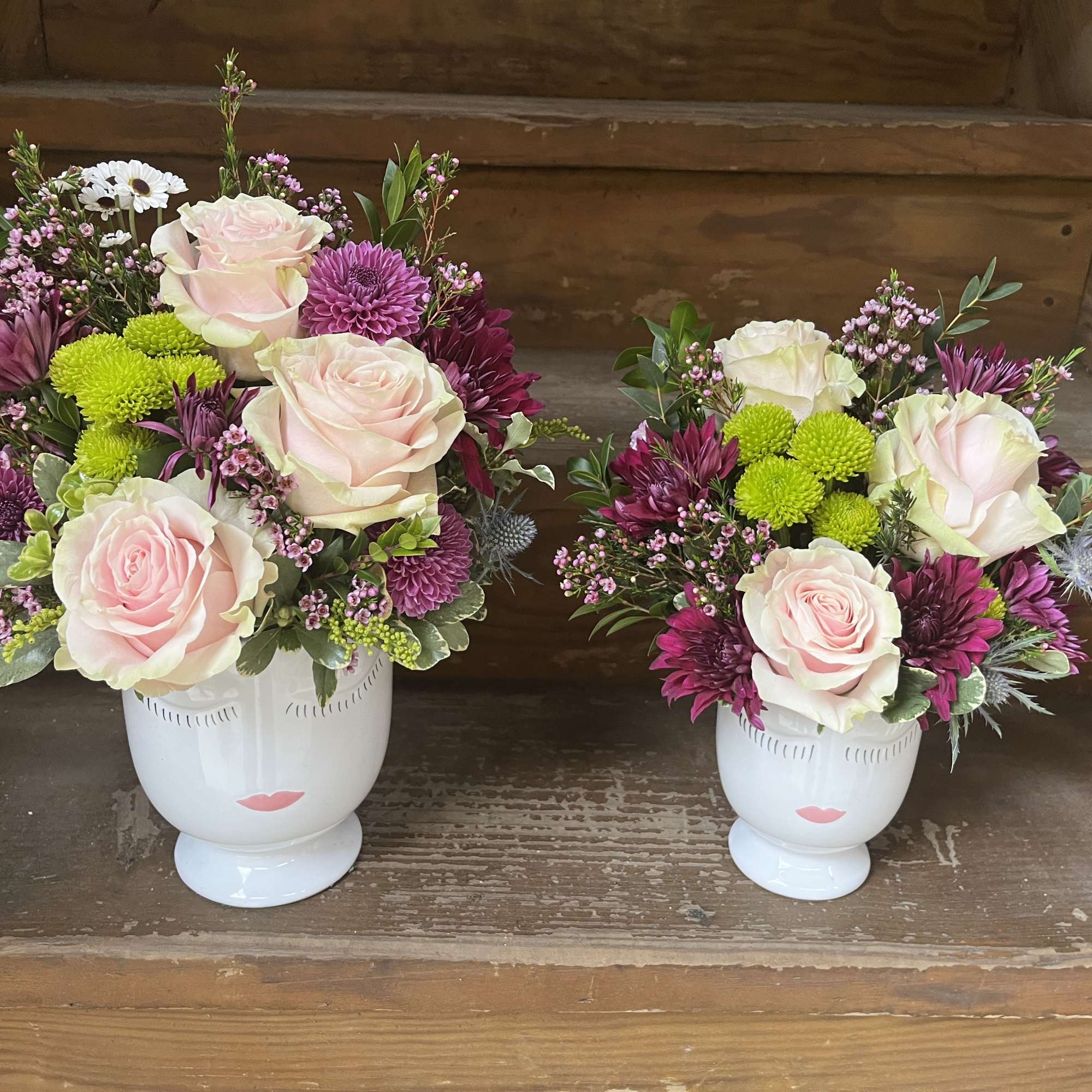 Face vase with floral accents available 2 sizes - flowers will vary