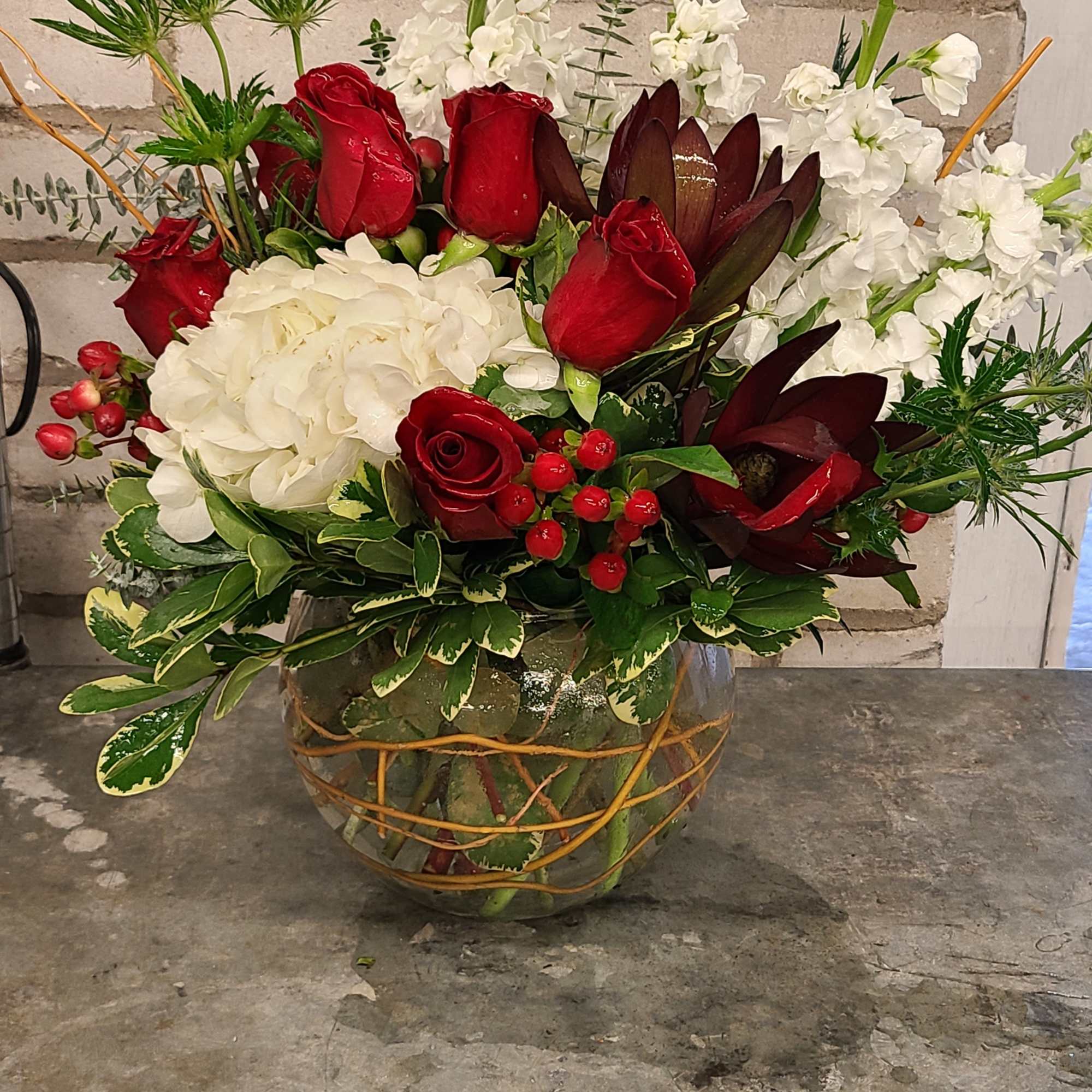 white hydrangeas that represent the pure snow, red roses the color 