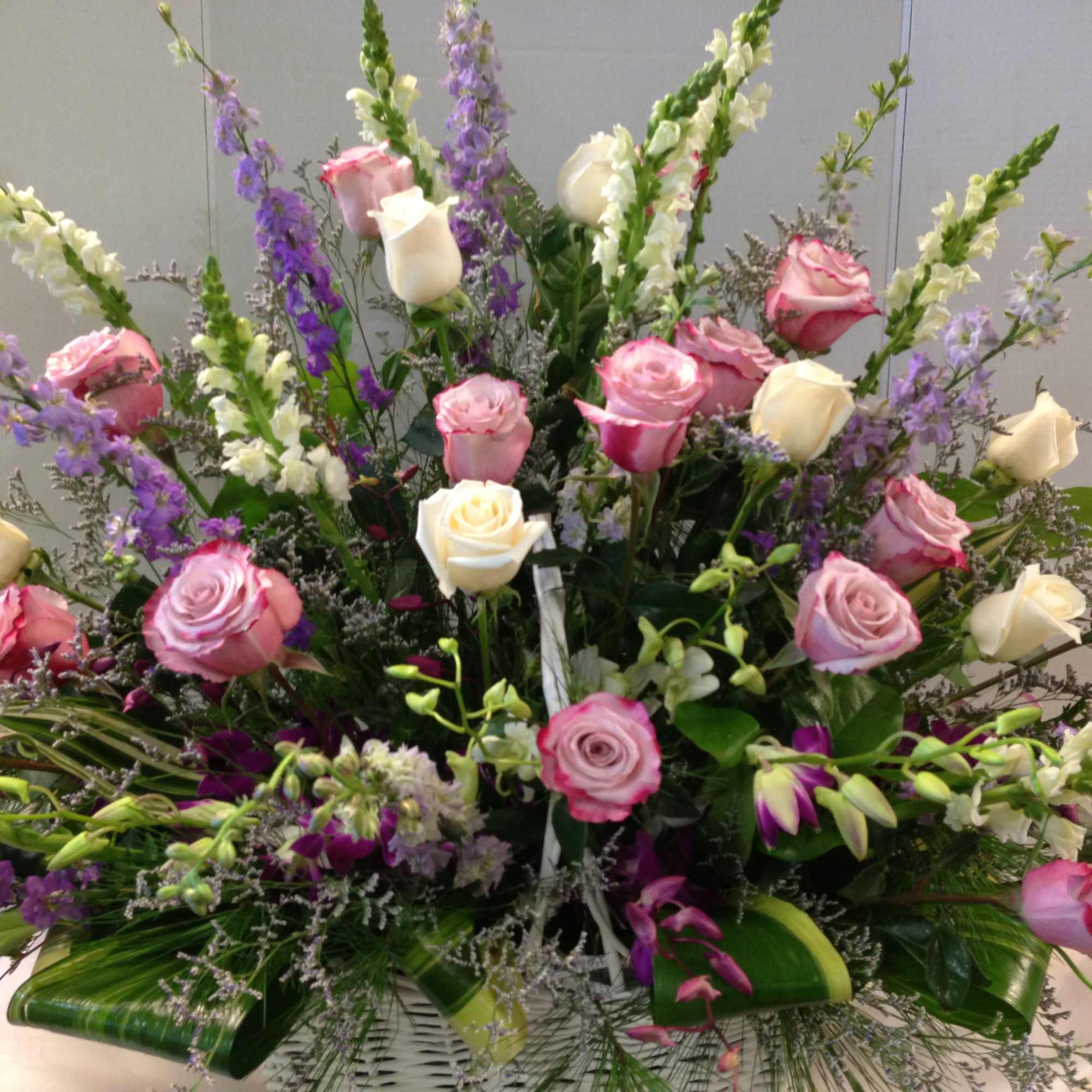 Bi -color Roses, White Roses , SnapDragons ,Orchids, assorted Greens