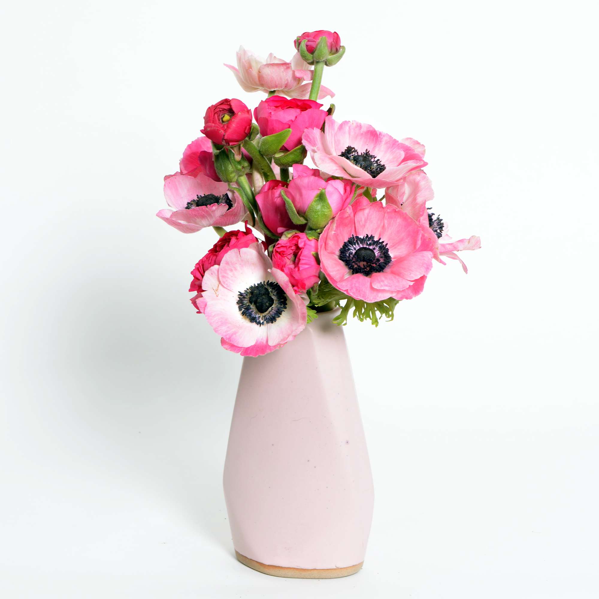 An sweet and simple but stunning arrangement of hot pink ranunculus and