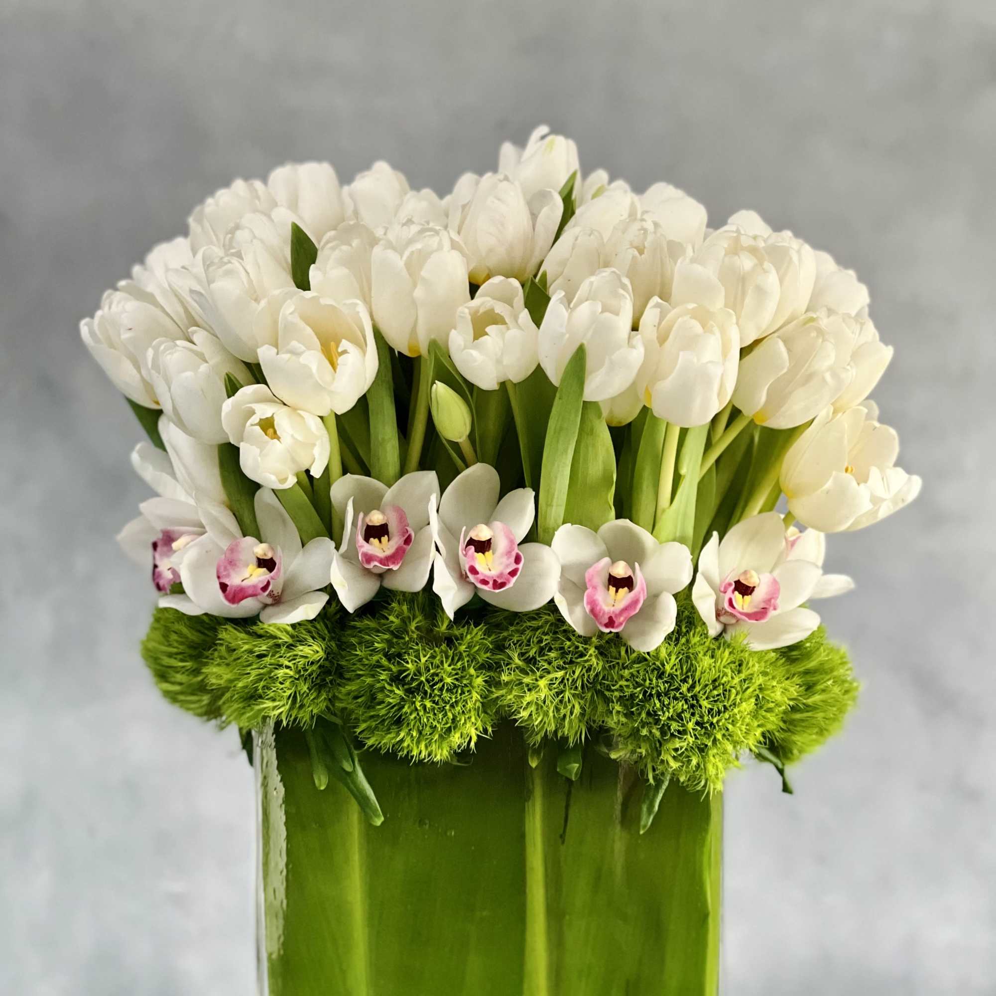 Amaze someone with this striking bouquet of tall Dutch Tulips and Orchids