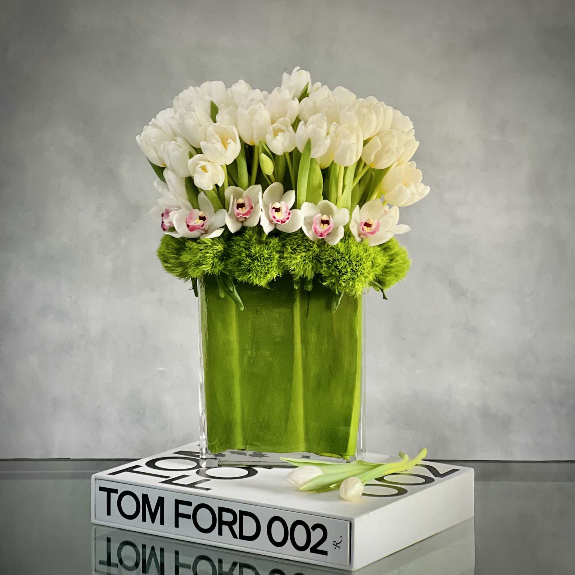 Amaze someone with this striking bouquet of tall Dutch Tulips and Orchids