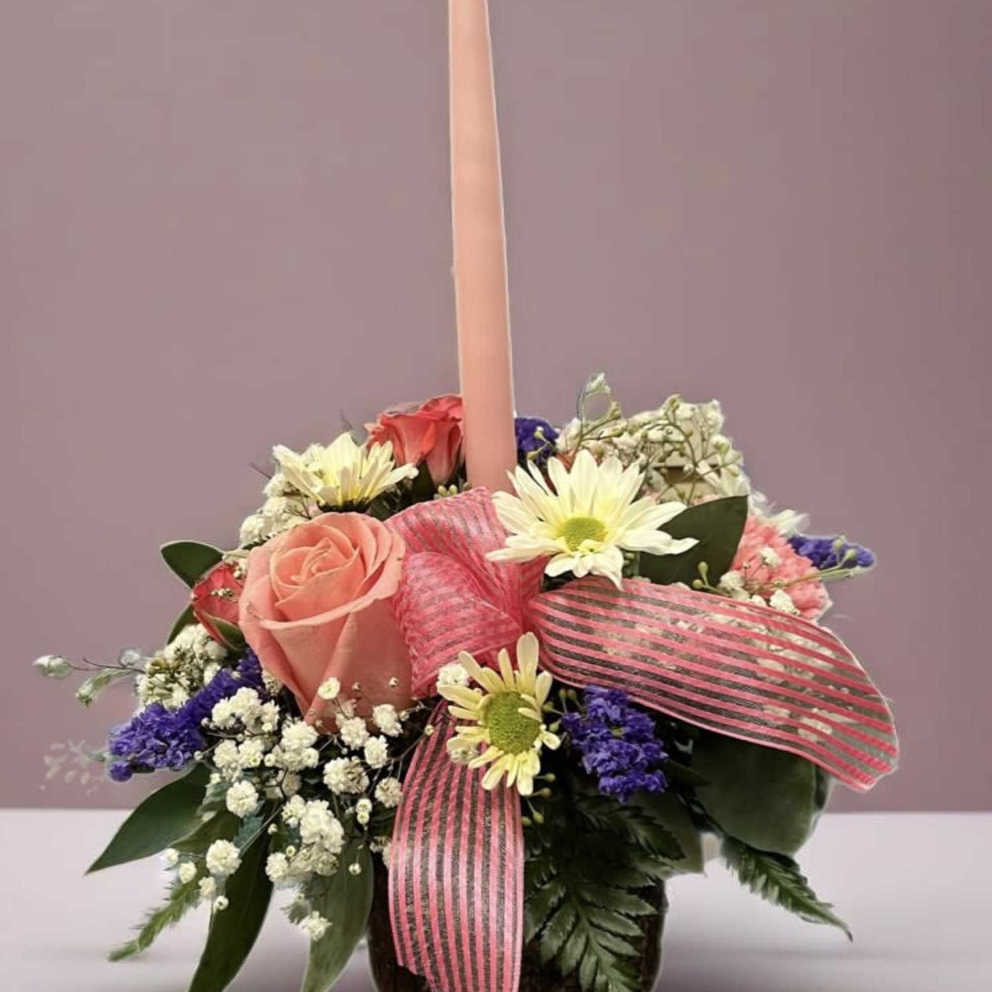 Rustic birch container with a (1)pink candle with pink white and purple
