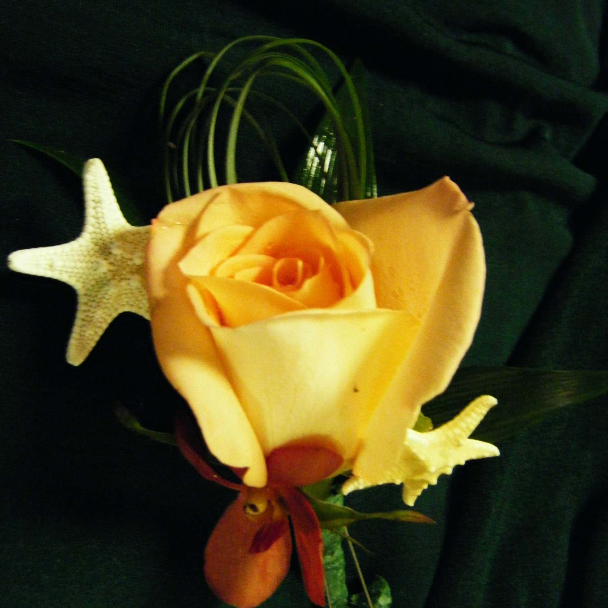 Our boutonnieres are custom designed in a wide range of flowers and