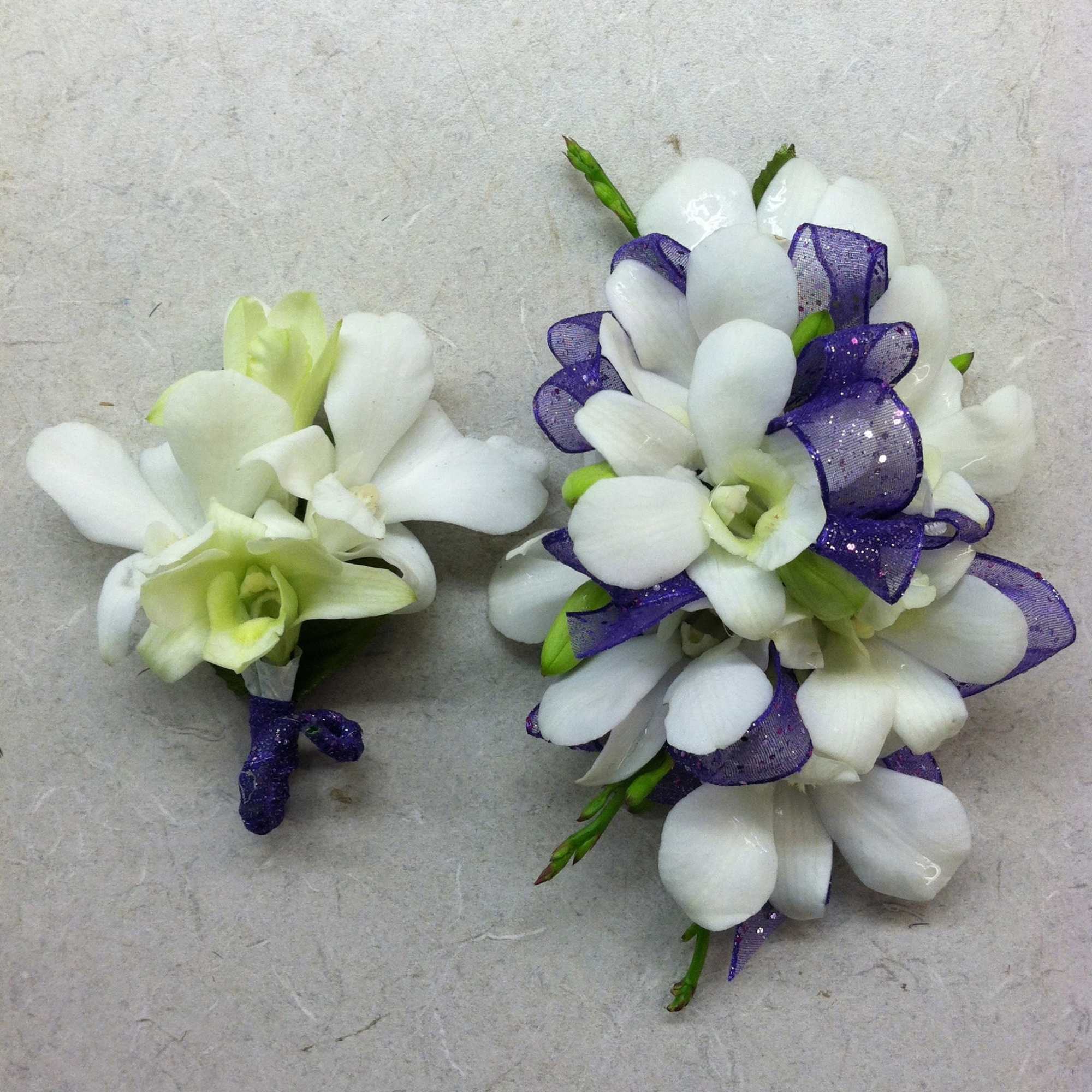 A classic white boutonni&egrave;re that compliments any suit. A perfect addition for