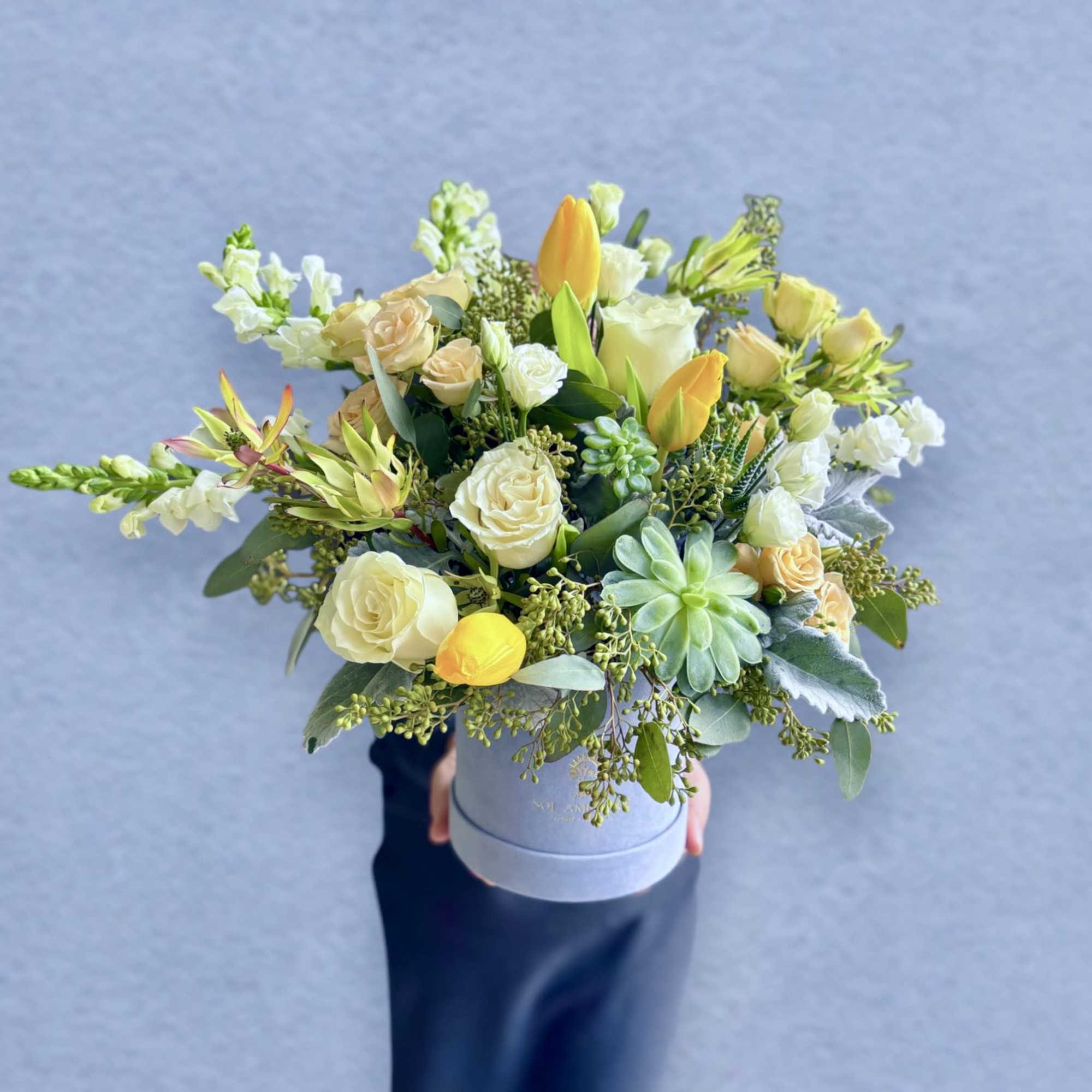 A beautiful velvet blue logo box full of gorgeous flowers. Large and