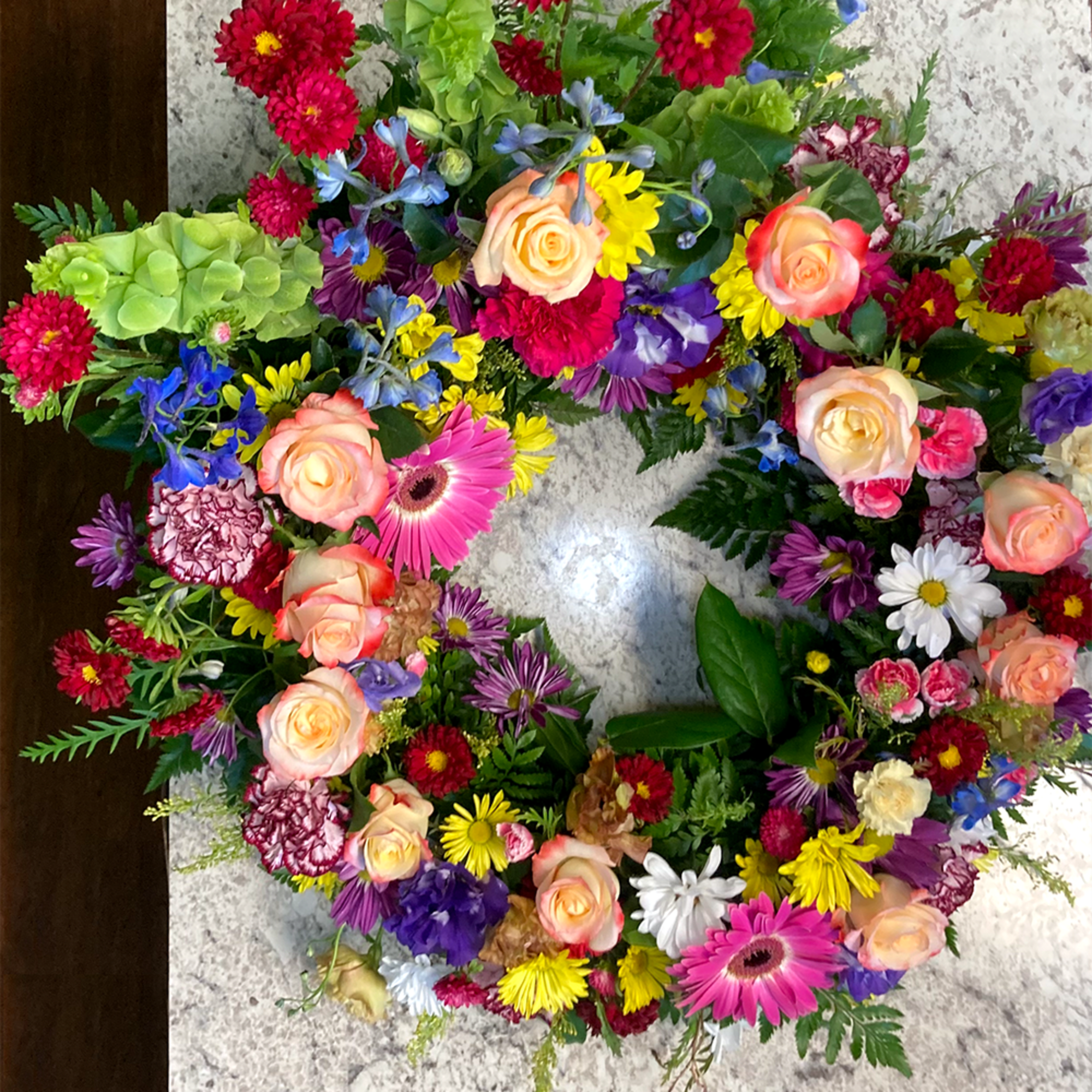 A vibrant urn wreath that honors cherished memories with grace, showcasing a