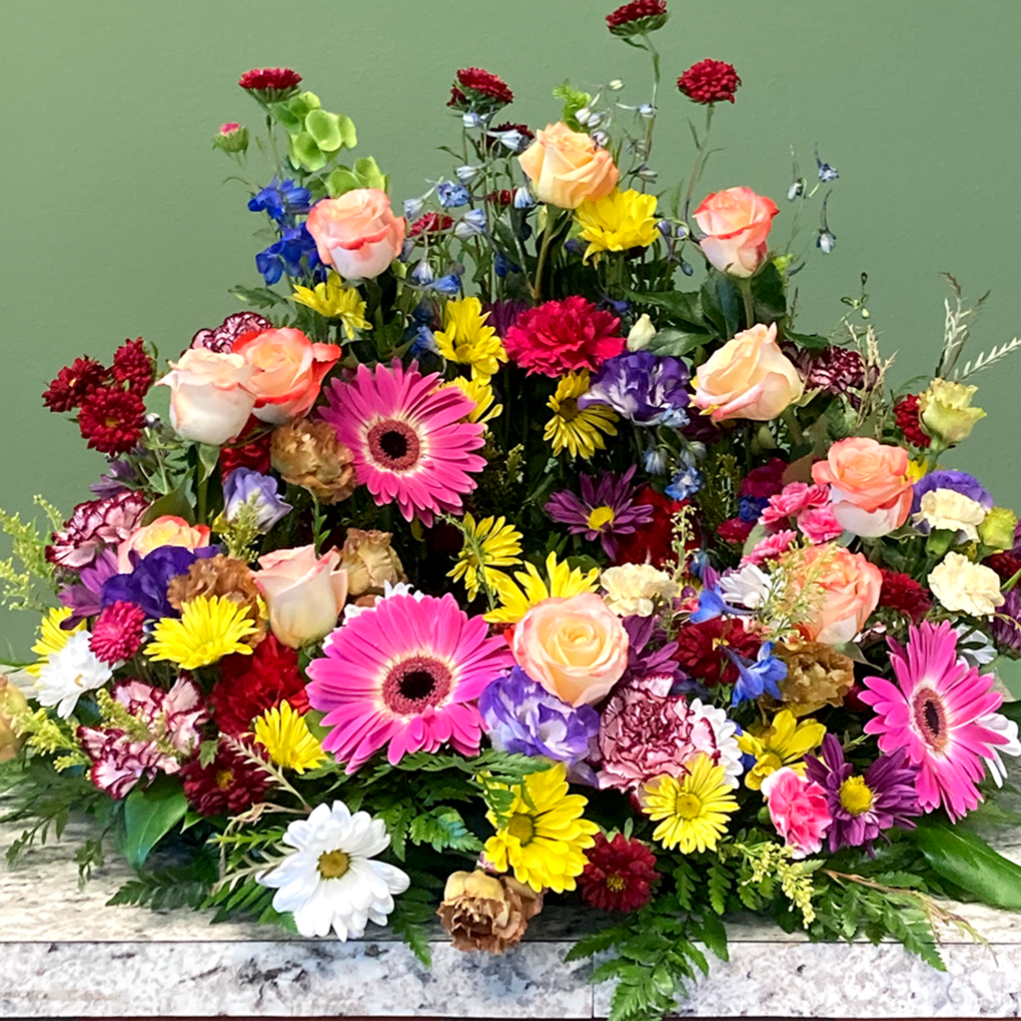 A vibrant urn wreath that honors cherished memories with grace, showcasing a