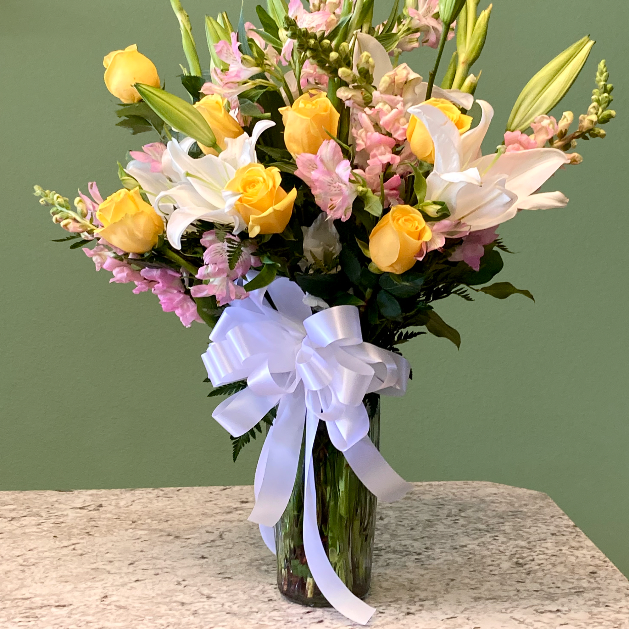 Sunshine is a radiant mixed arrangement that showcases a bright palette of