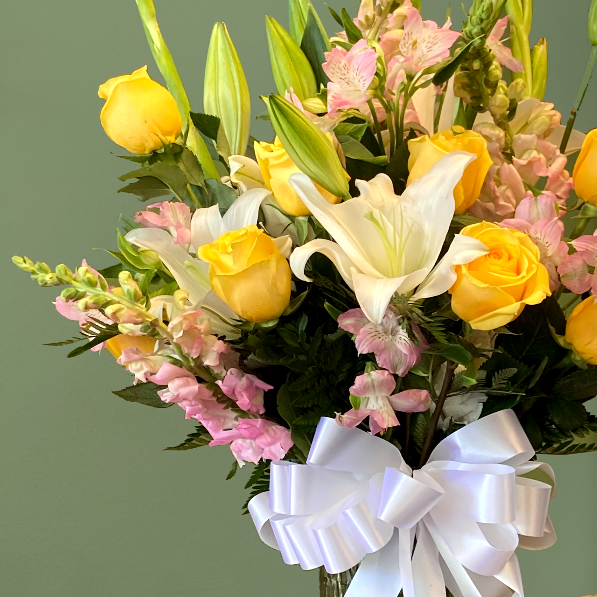 Sunshine is a radiant mixed arrangement that showcases a bright palette of