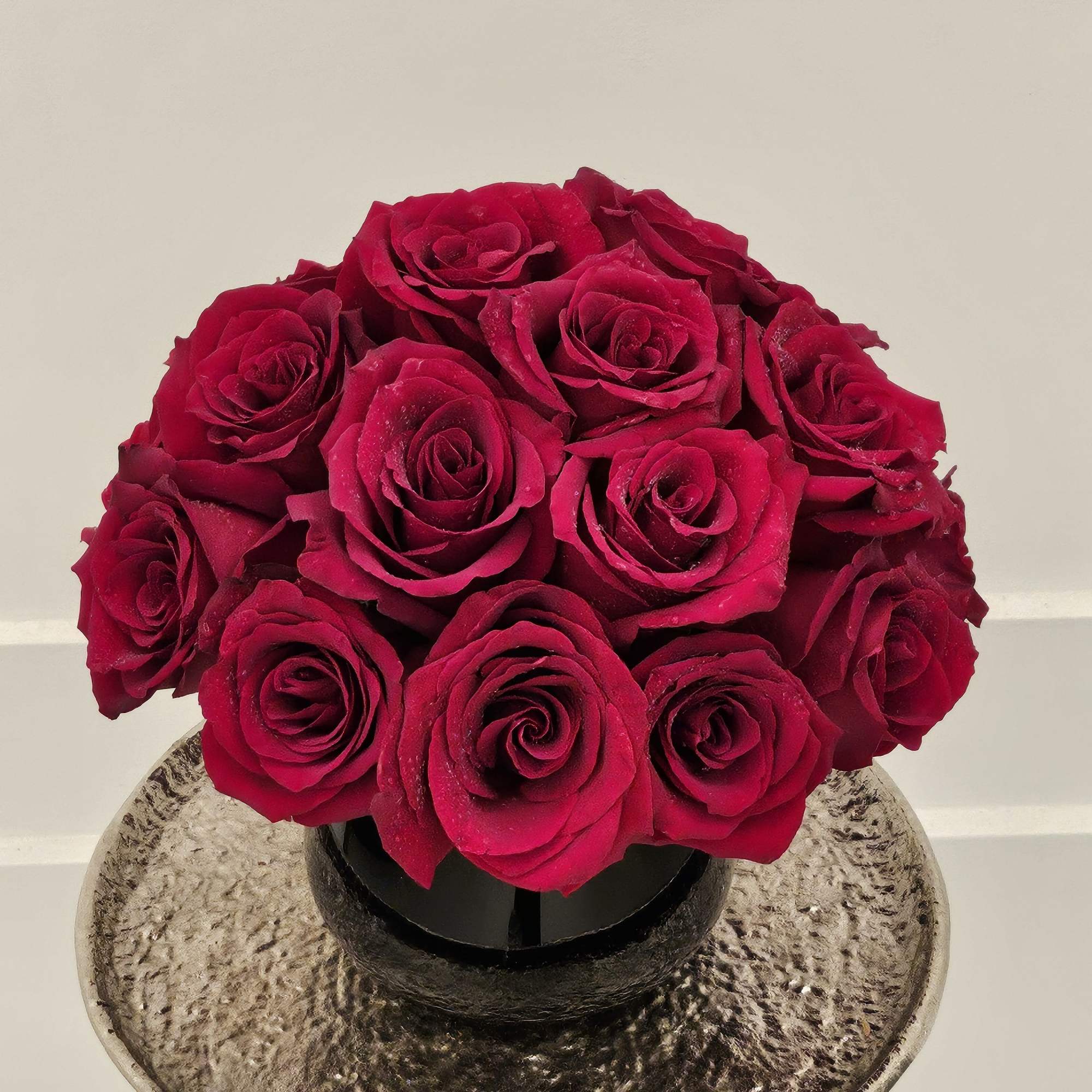24 red roses in a modern vase
