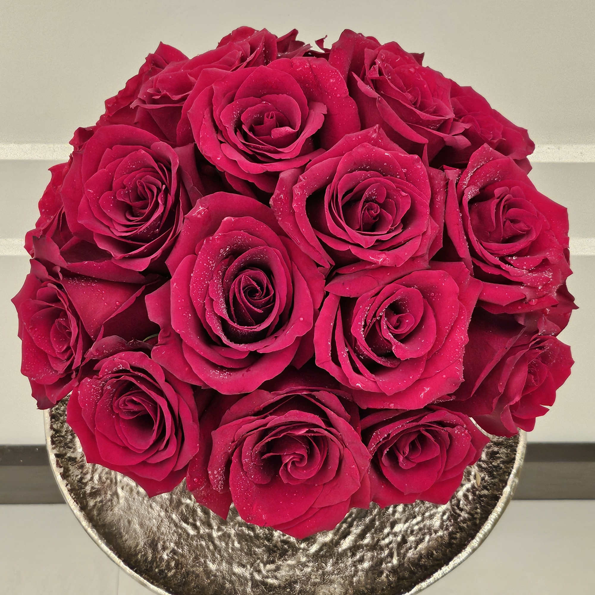 24 red roses in a modern vase