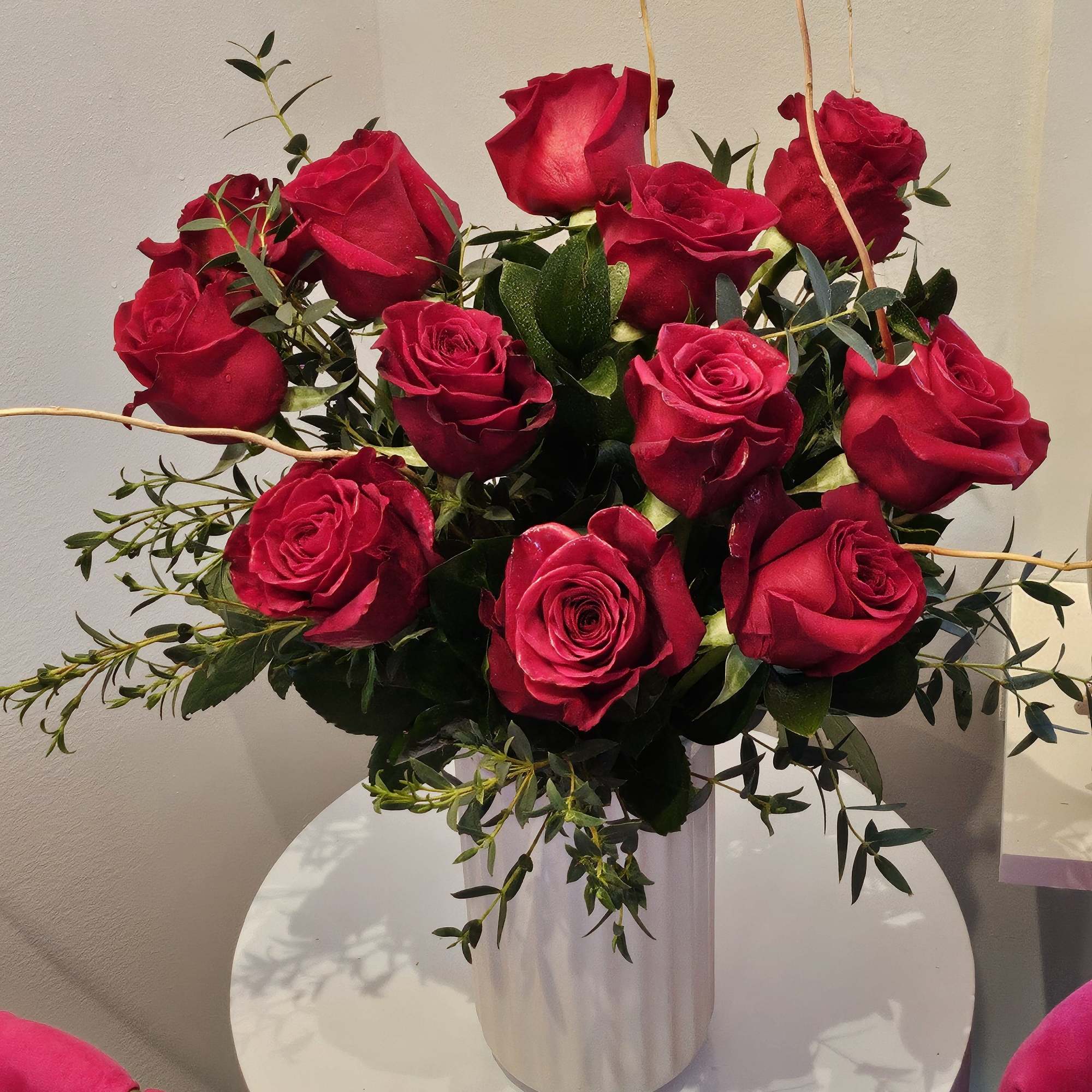  A simple but elegant display of vibrant red roses. Arranged with