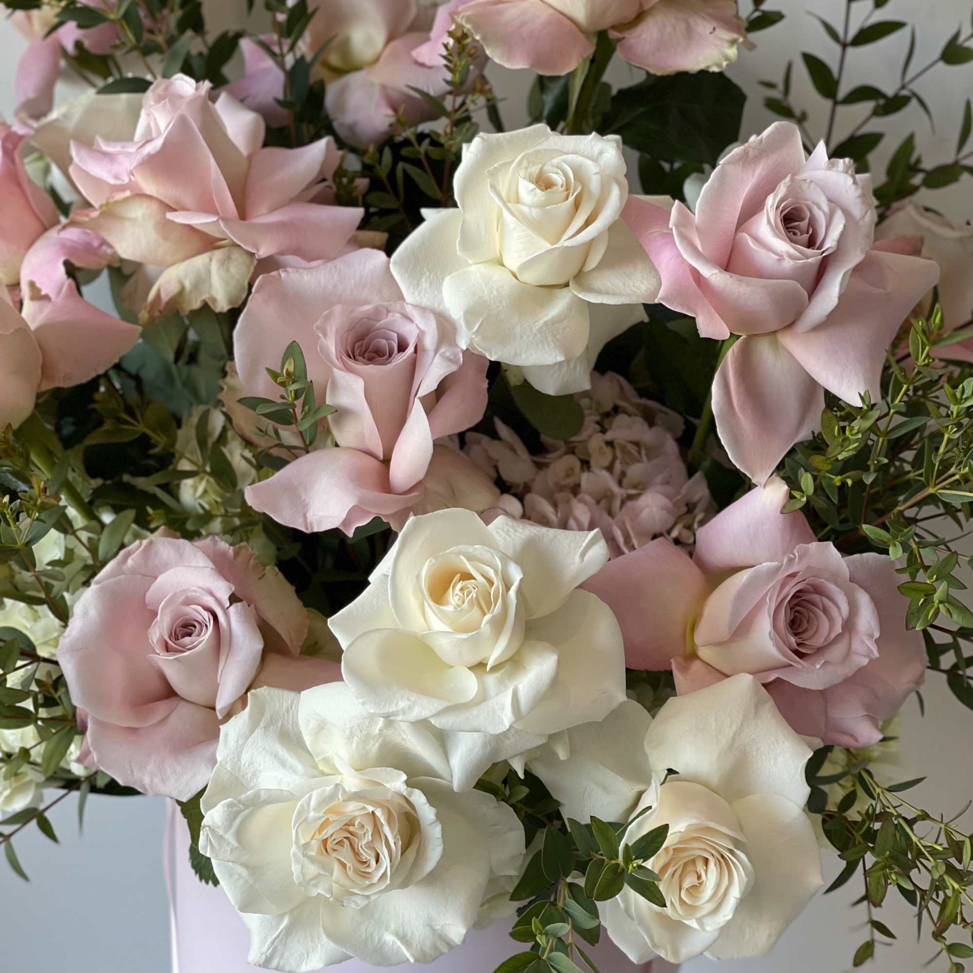 Beautiful pink and white roses in our signature box. Beautiful pink and white roses in our signature box.