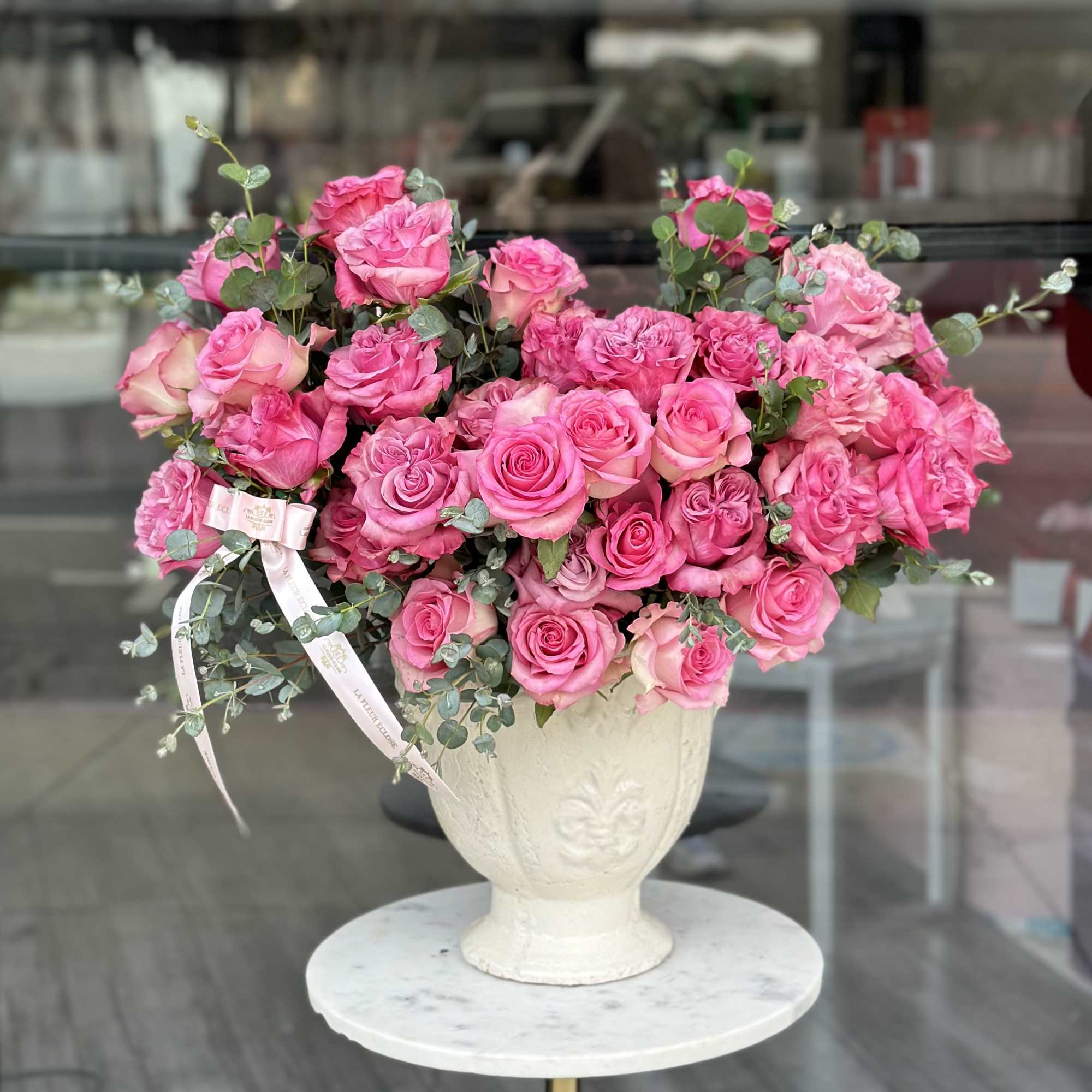 Pink rose mix in a vintage vase Pink rose mix in a vintage vase