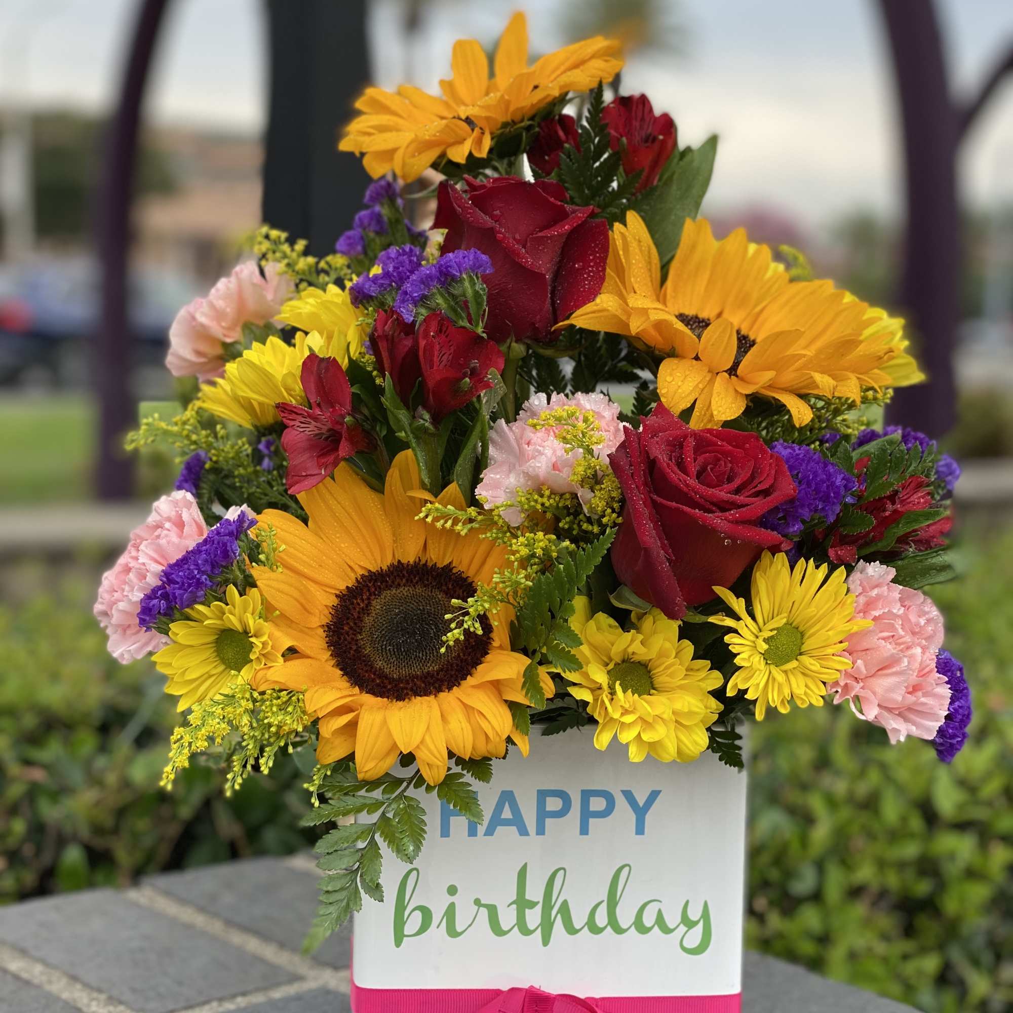 Happy birthday keepsake container and beautiful flower arrangement consisting of in season Happy birthday keepsake container and beautiful flower arrangement consisting of in season