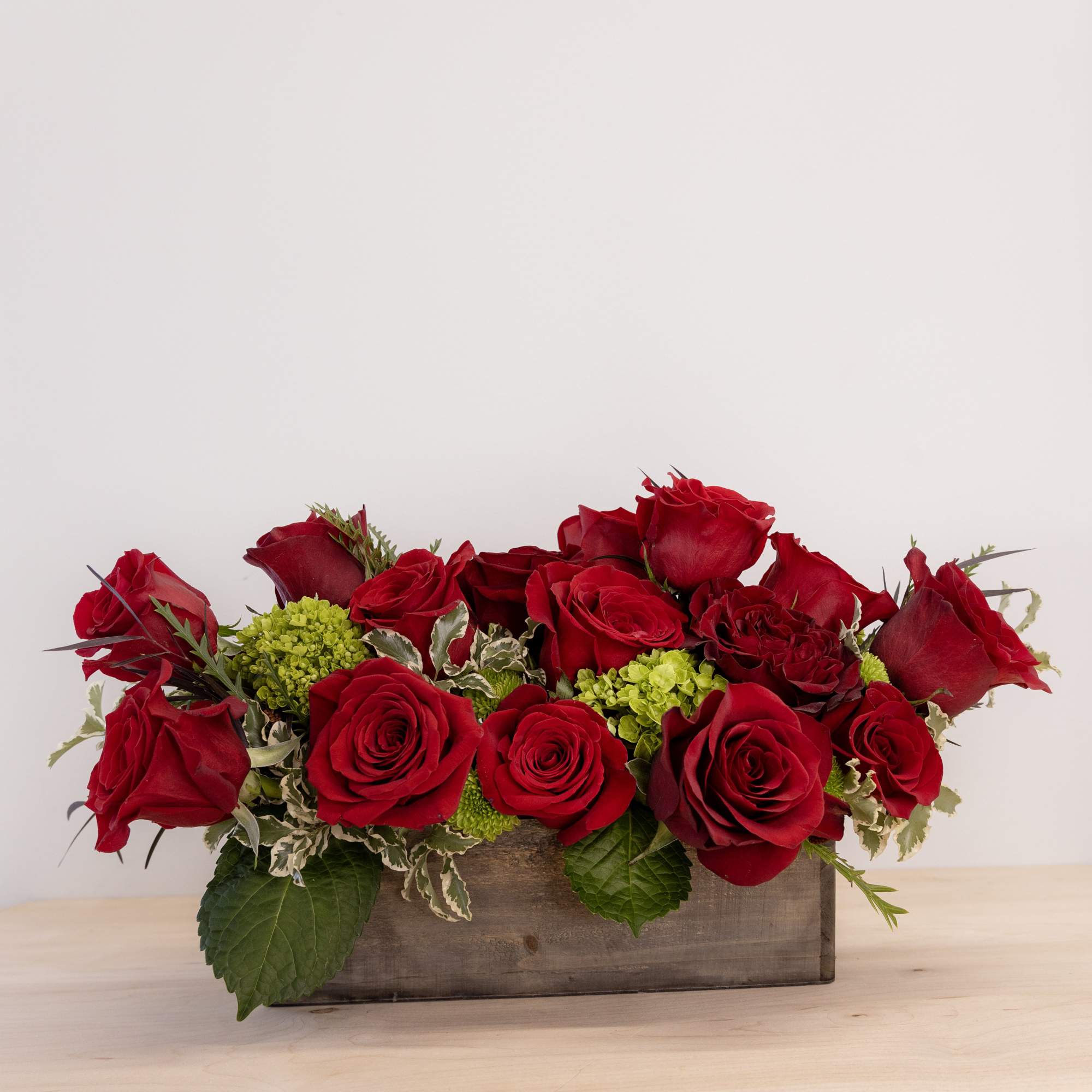 This isn&#039;t your classic dozen roses!  Artful design in a wooden