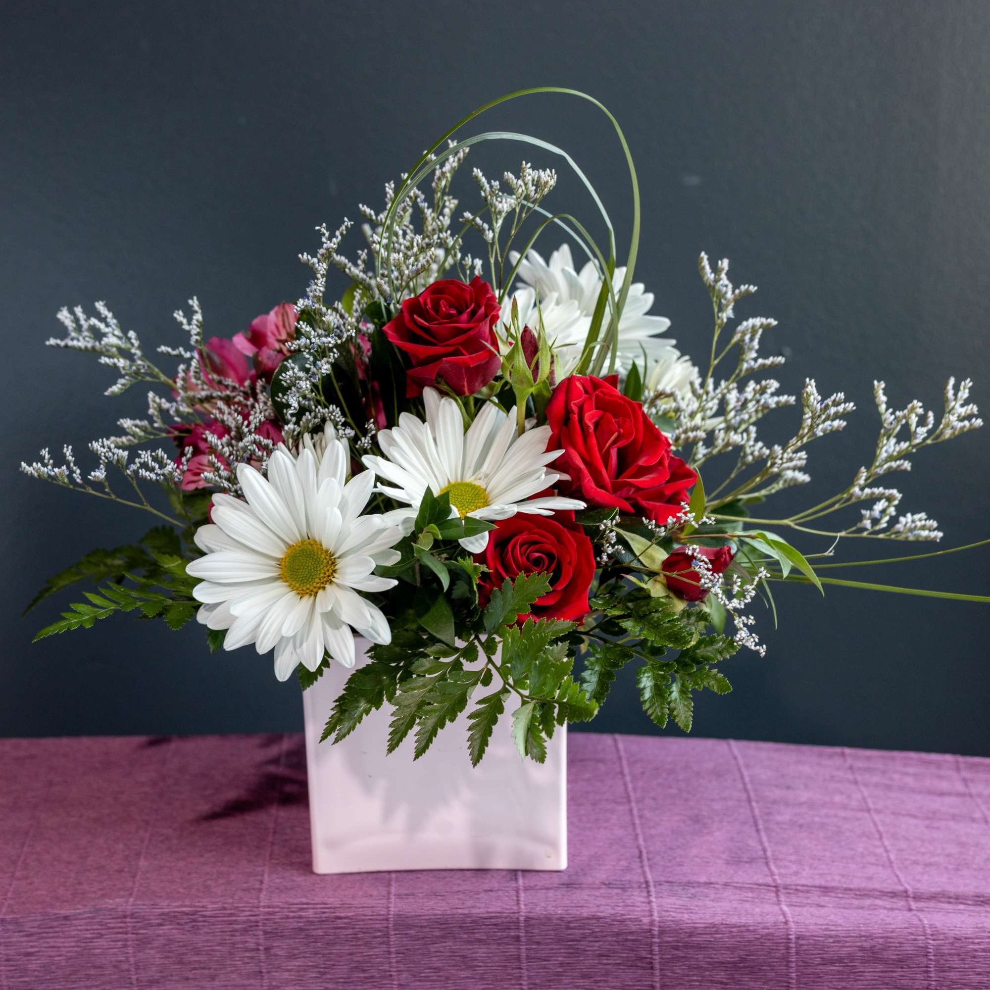 Bring in spring with this sweet short arrangement in a soft pink