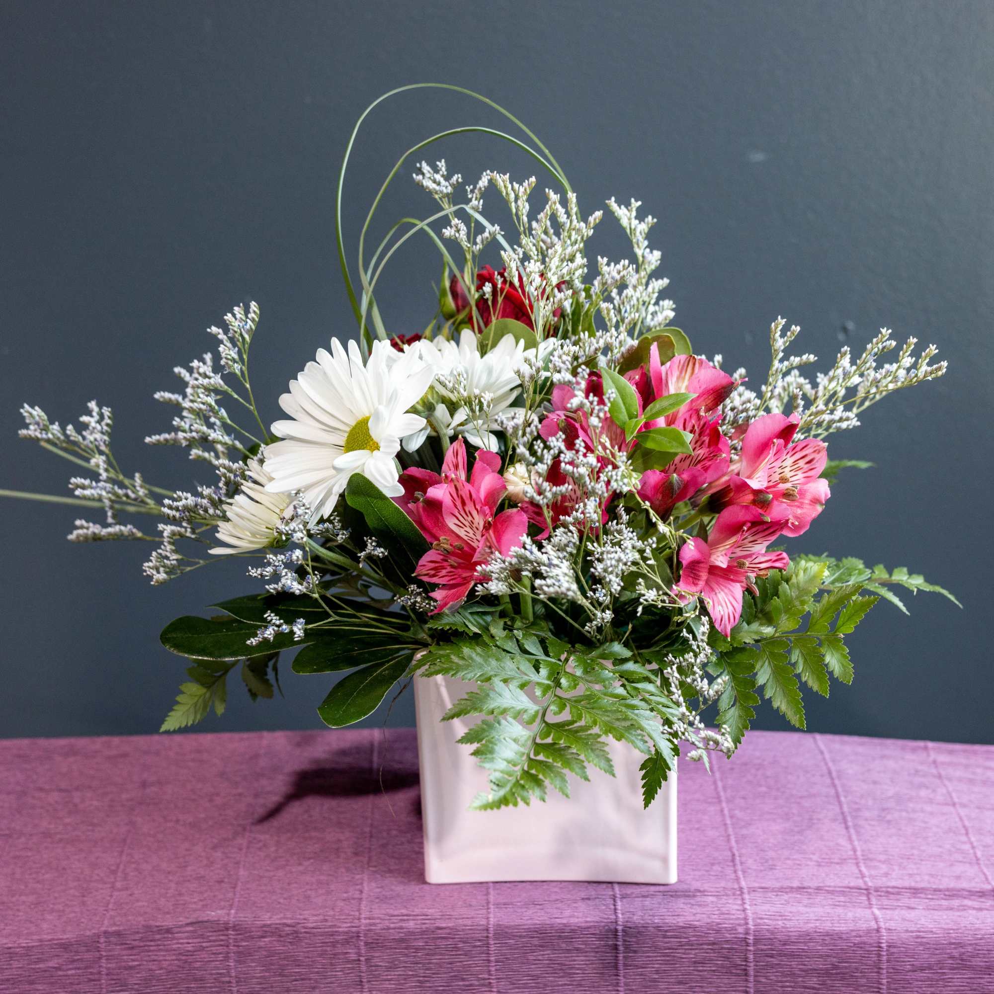 Bring in spring with this sweet short arrangement in a soft pink