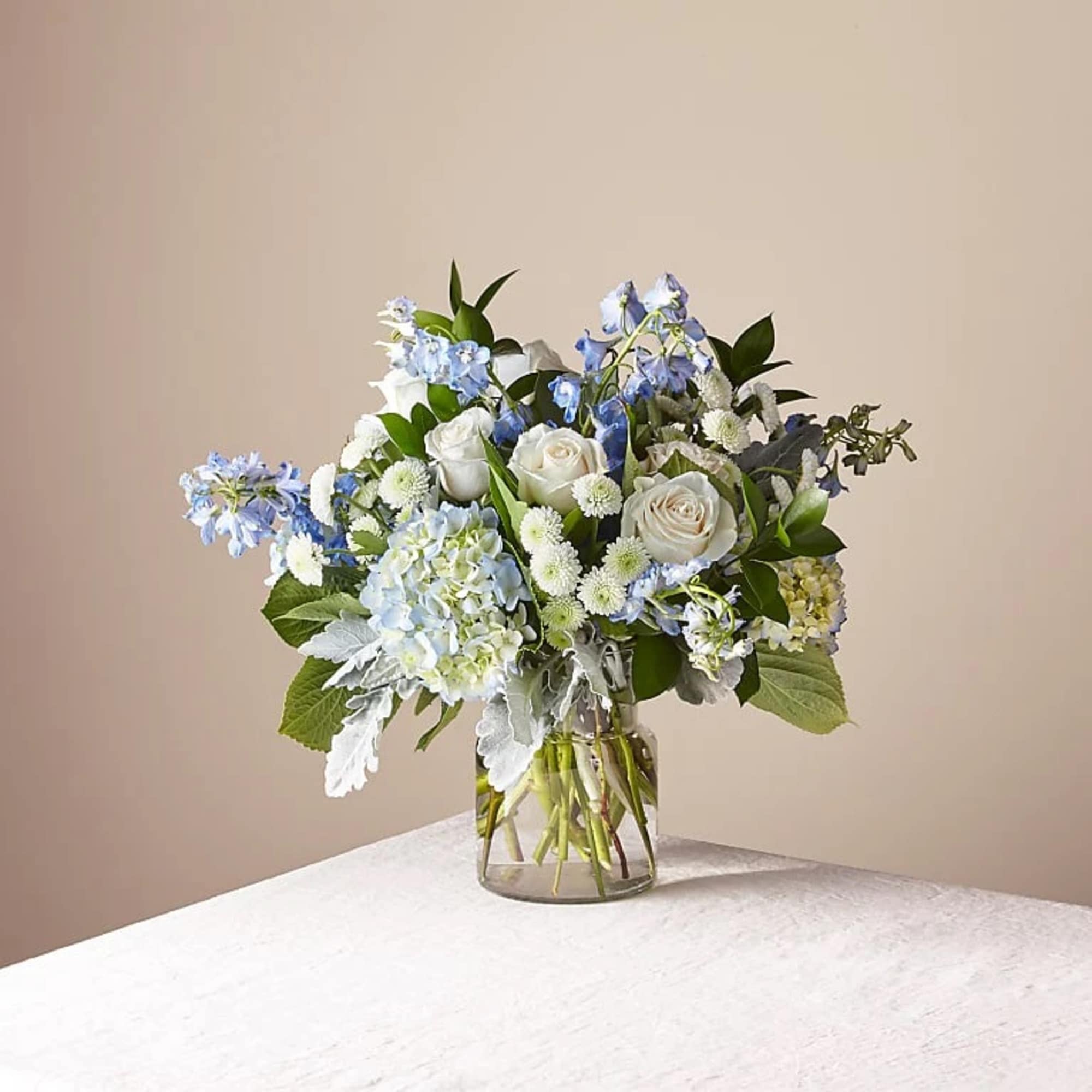 Experience a modern and unique floral arrangement that beautifully blends the sentiments Experience a modern and unique floral arrangement that beautifully blends the sentiments