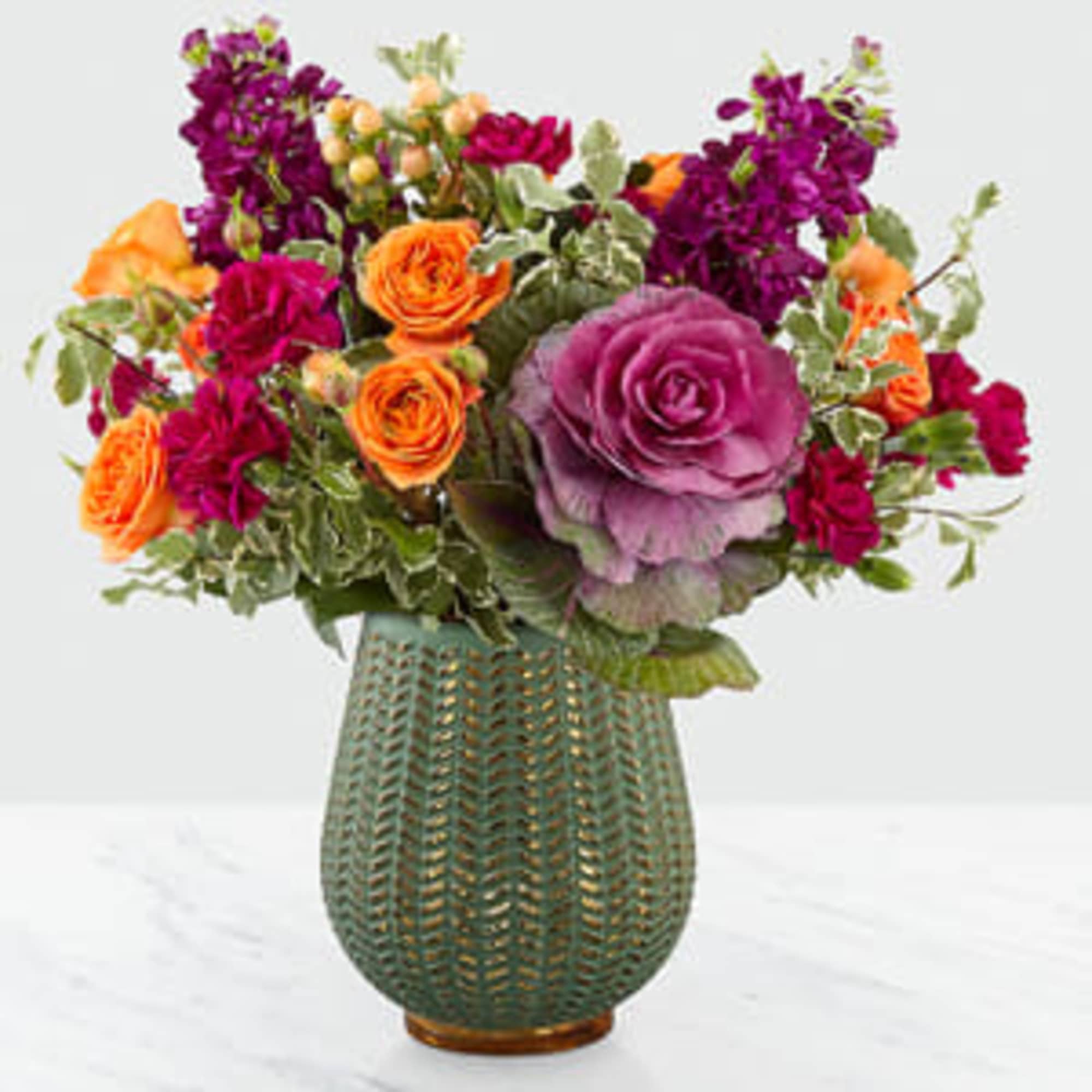 Celebrate the season with a fresh take on traditional harvest arrangements. Comprised