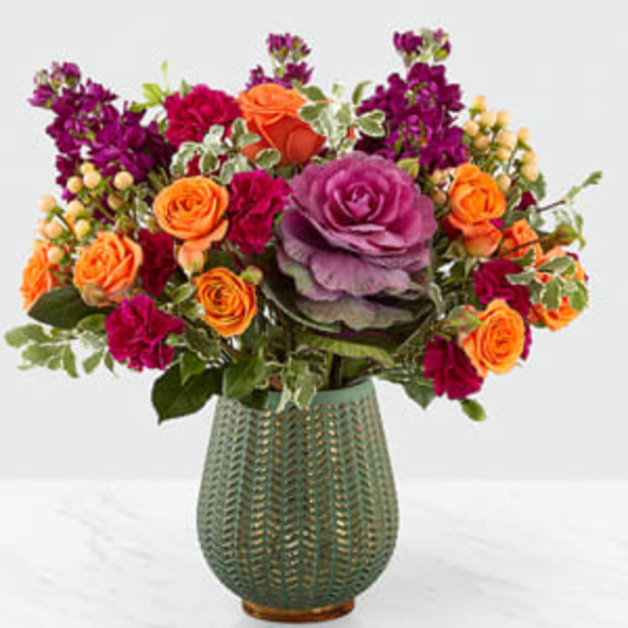 Celebrate the season with a fresh take on traditional harvest arrangements. Comprised