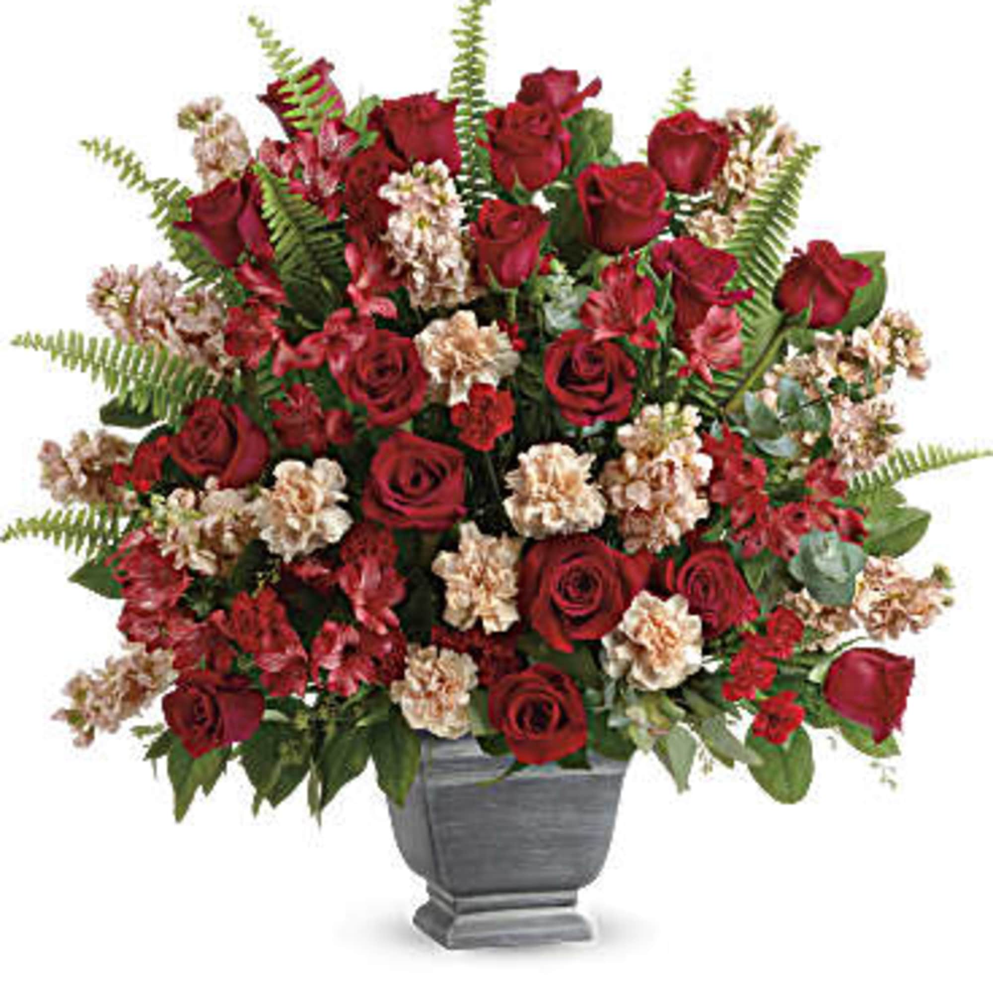 Bold and beautiful, this majestic mix of red roses and fresh greens