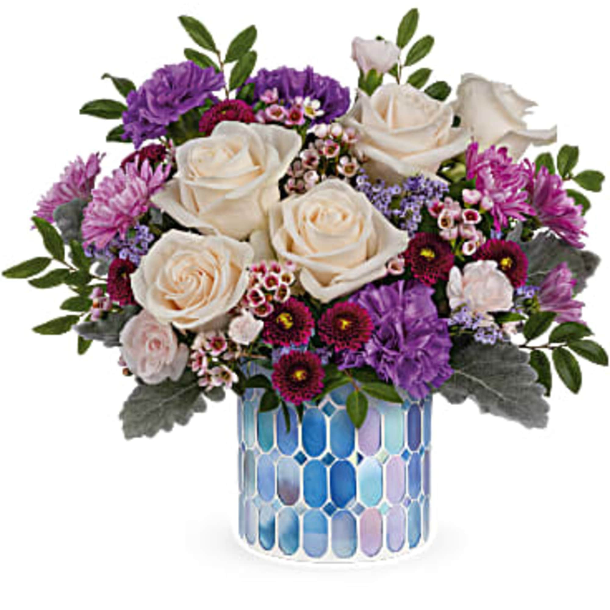 Springtime beauty at its best! Creamy roses and deep purple blooms are